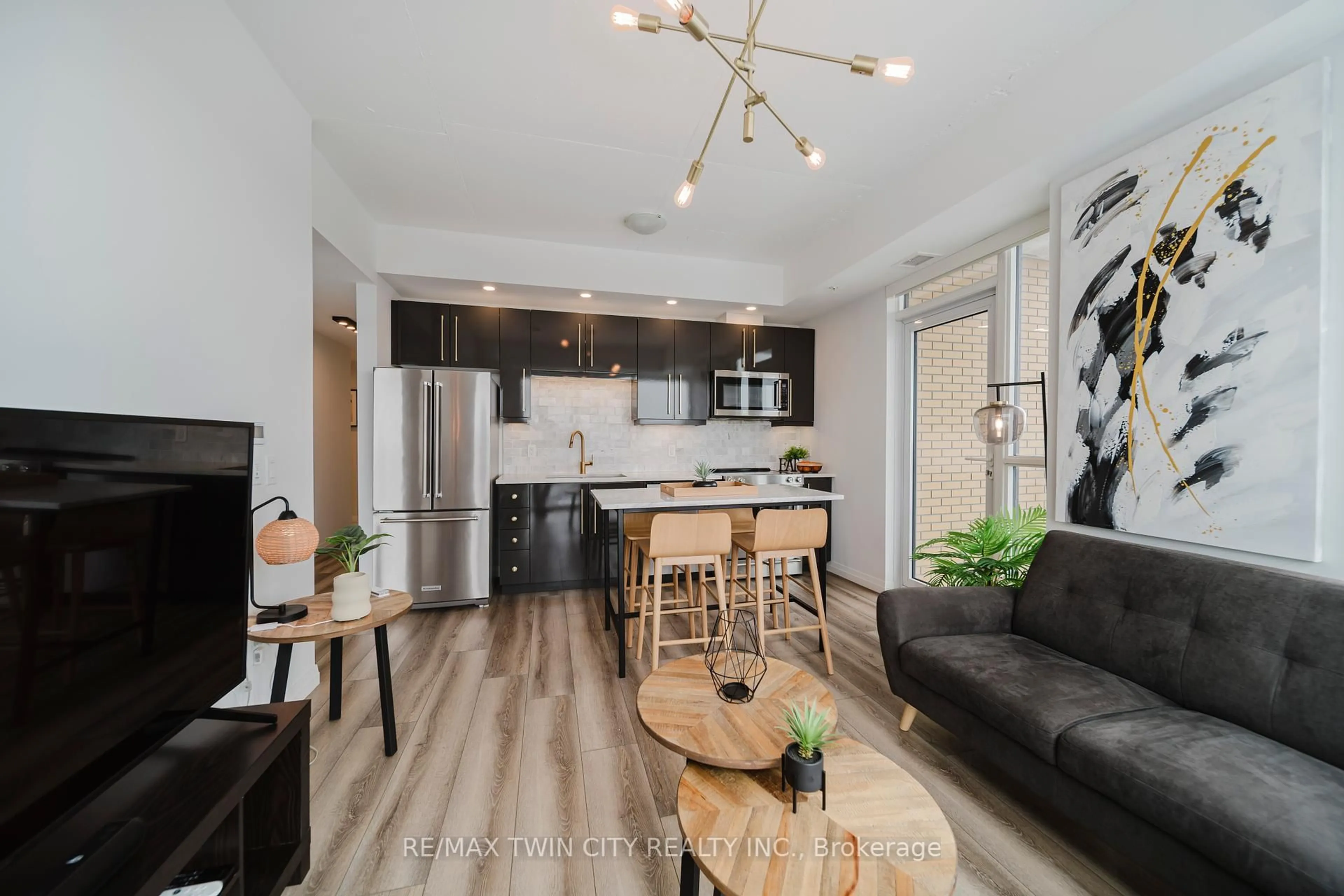 Open concept kitchen, wood/laminate floor for 108 Garment St #2608, Kitchener Ontario N2G 0E2