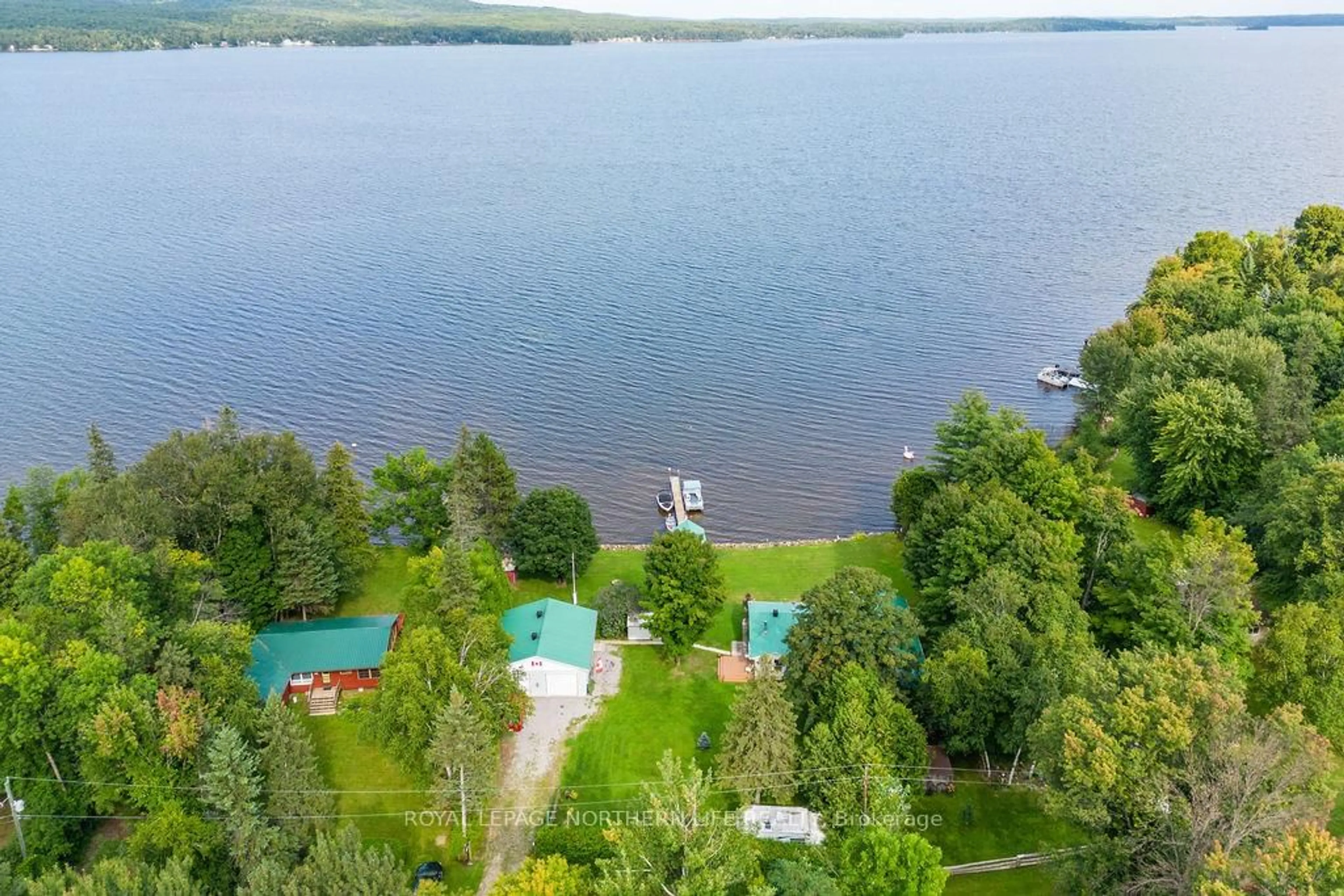 A pic from outside/outdoor area/front of a property/back of a property/a pic from drone, water/lake/river/ocean view for 347 Black Point Rd, Golden Lake Ontario K0J 1X0