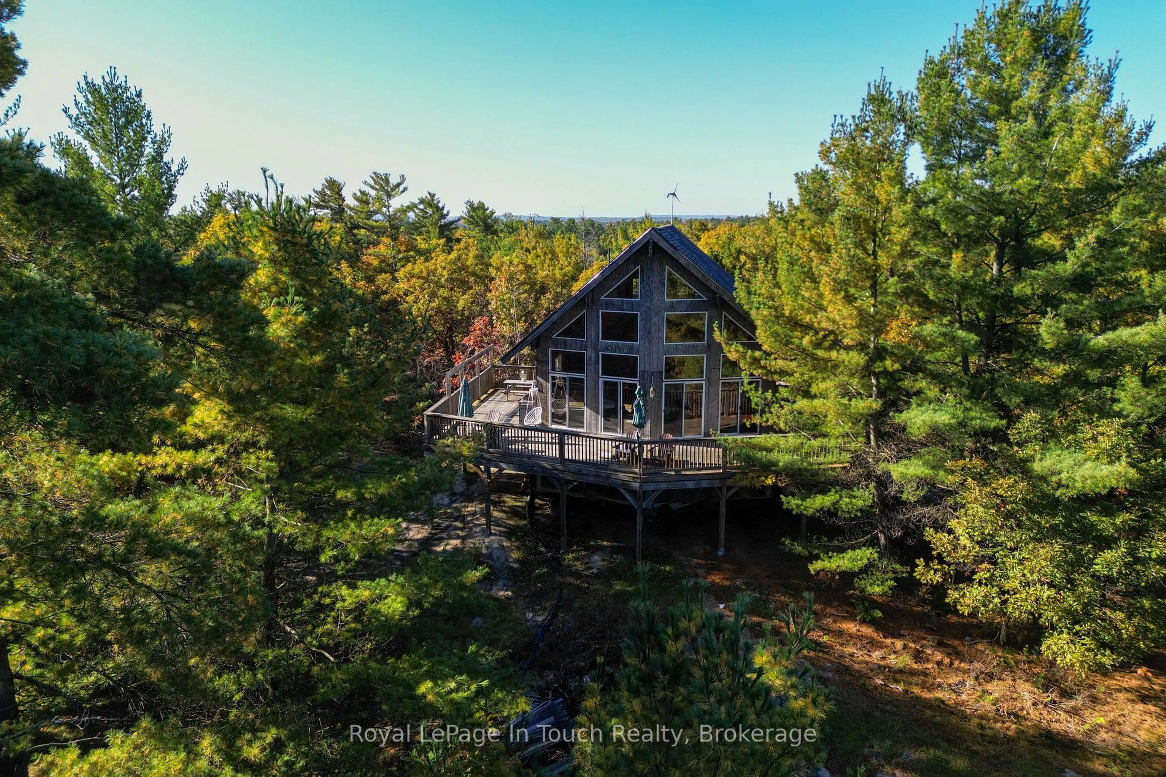 A pic from outside/outdoor area/front of a property/back of a property/a pic from drone, water/lake/river/ocean view for 1276 Island 980, Georgian Bay Ontario P0E 1E0