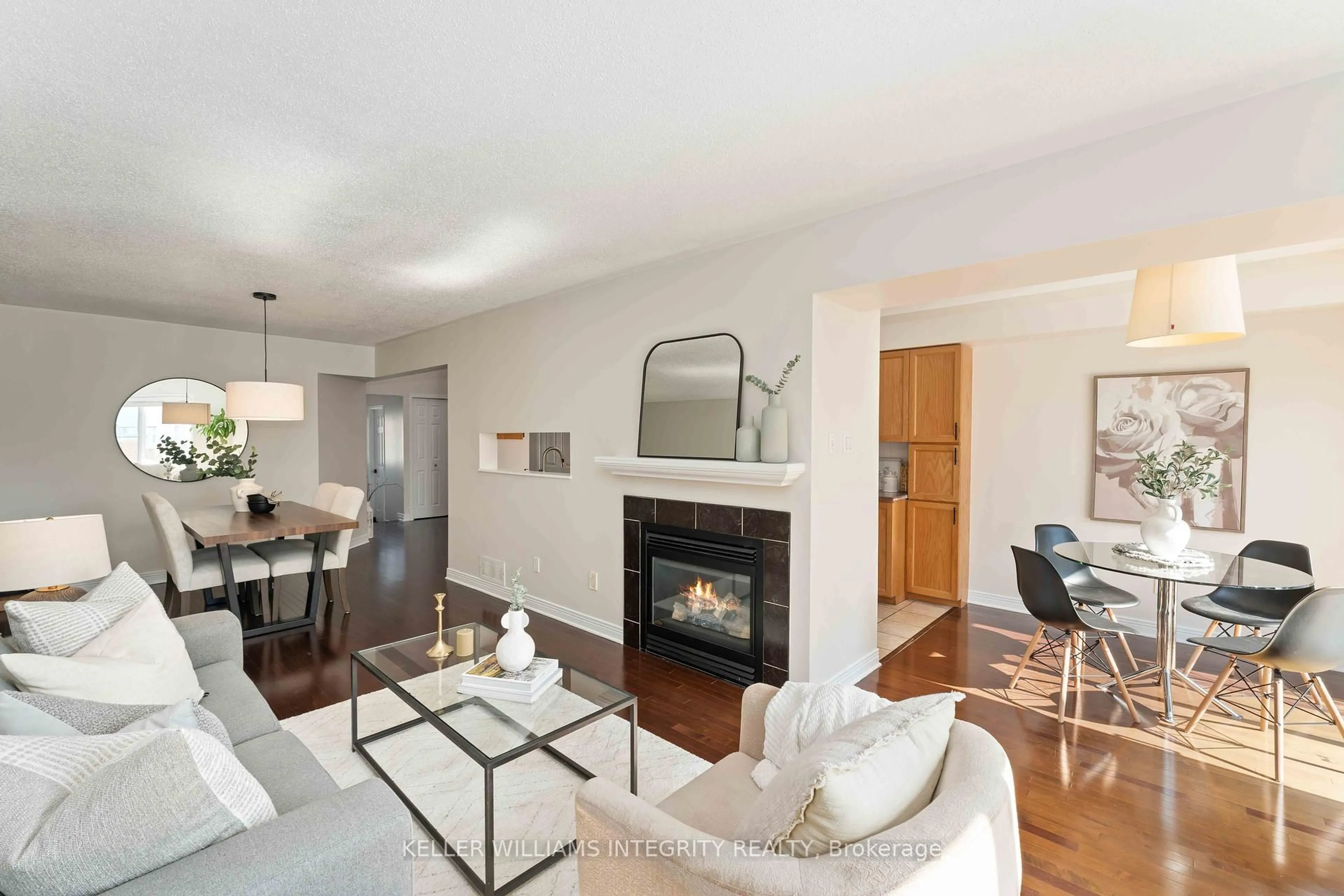 Living room with furniture, wood/laminate floor for 4638 Ogilvie Walk Cres, Cyrville - Carson Grove - Pineview Ontario K1J 1G7