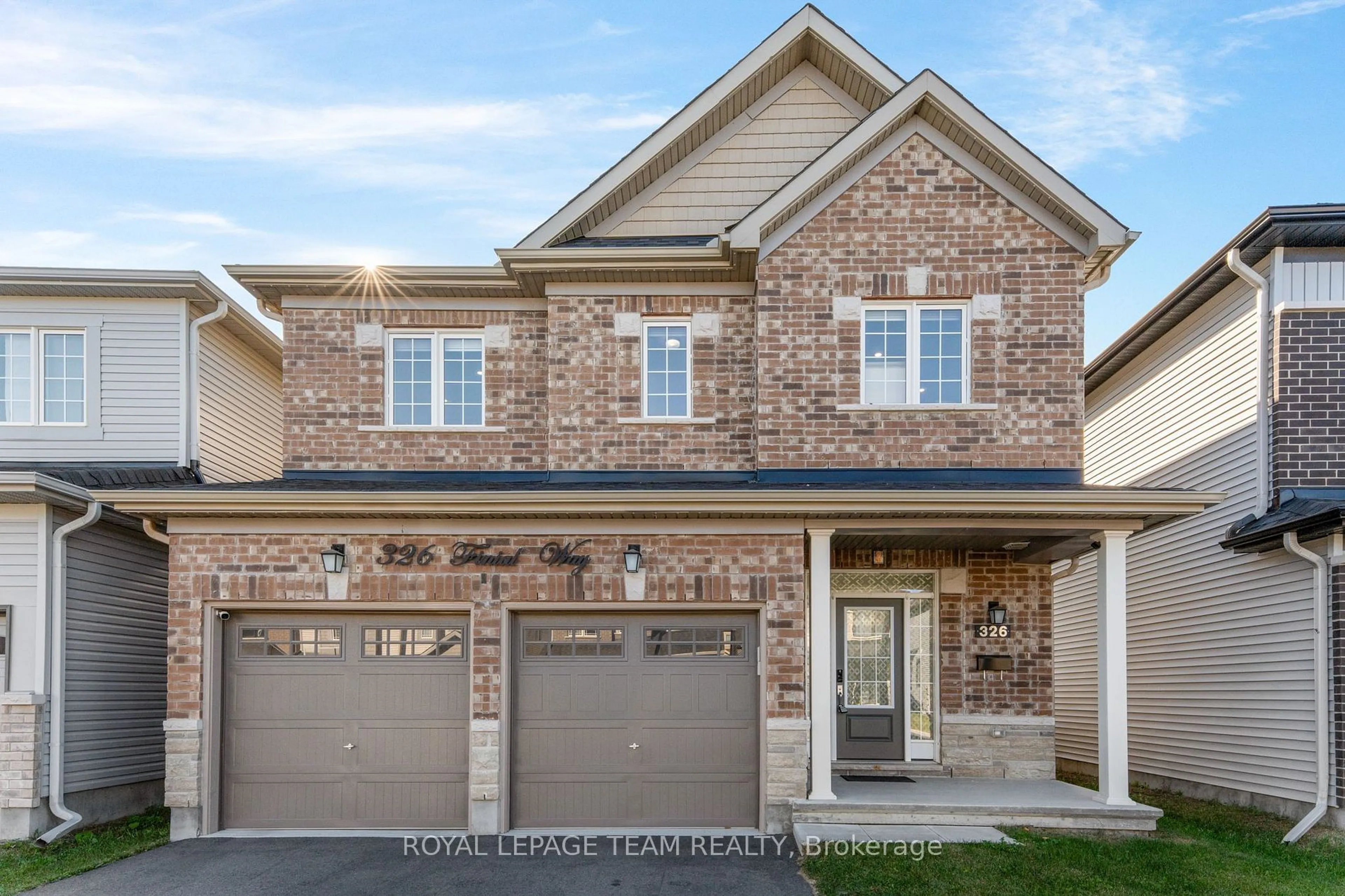 Home with brick exterior material, street for 326 Finial Way, Barrhaven Ontario K2J 3V5