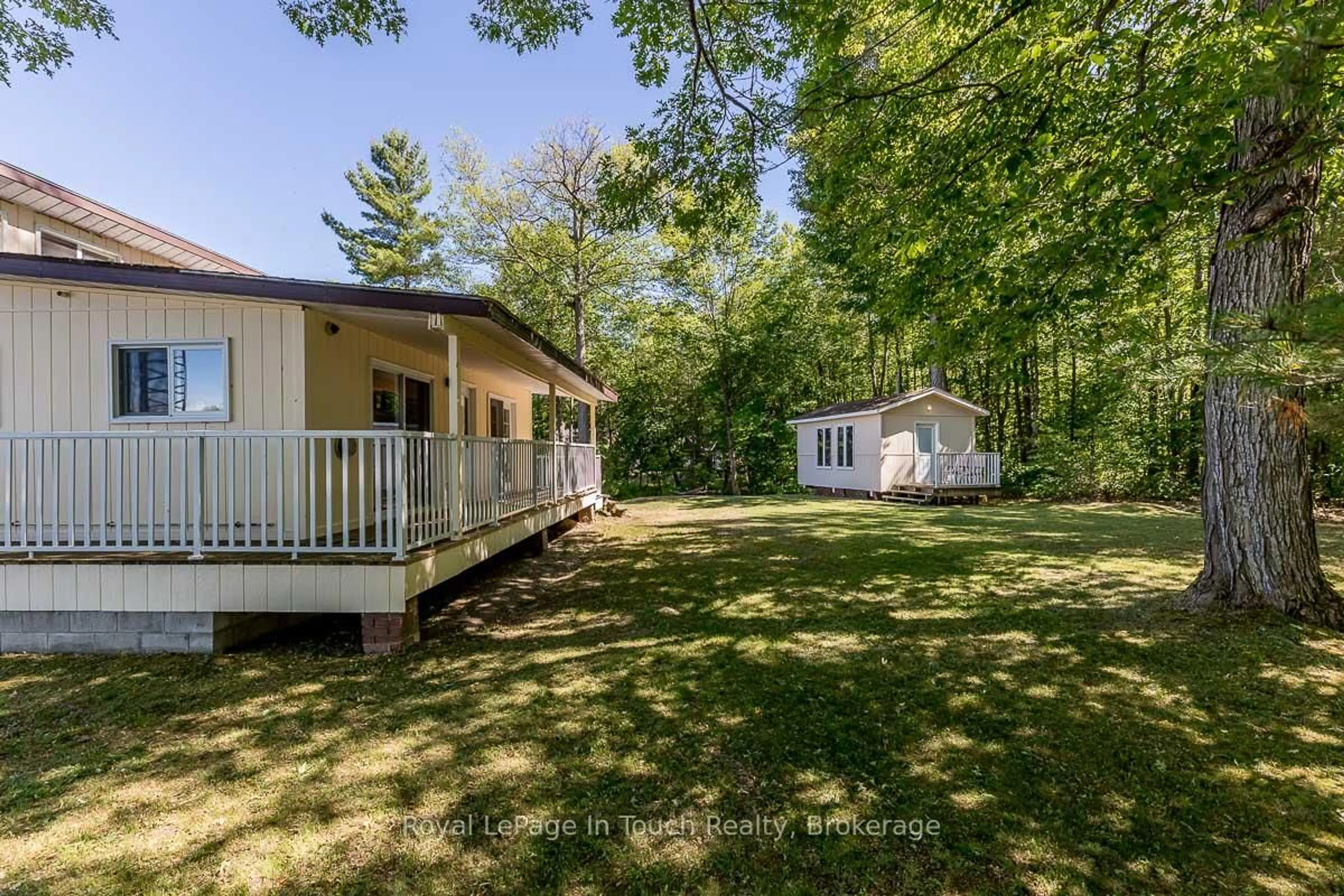 A pic from outside/outdoor area/front of a property/back of a property/a pic from drone, forest/trees view for 36 Yellowhead Island, Georgian Bay Ontario L0K 1S0