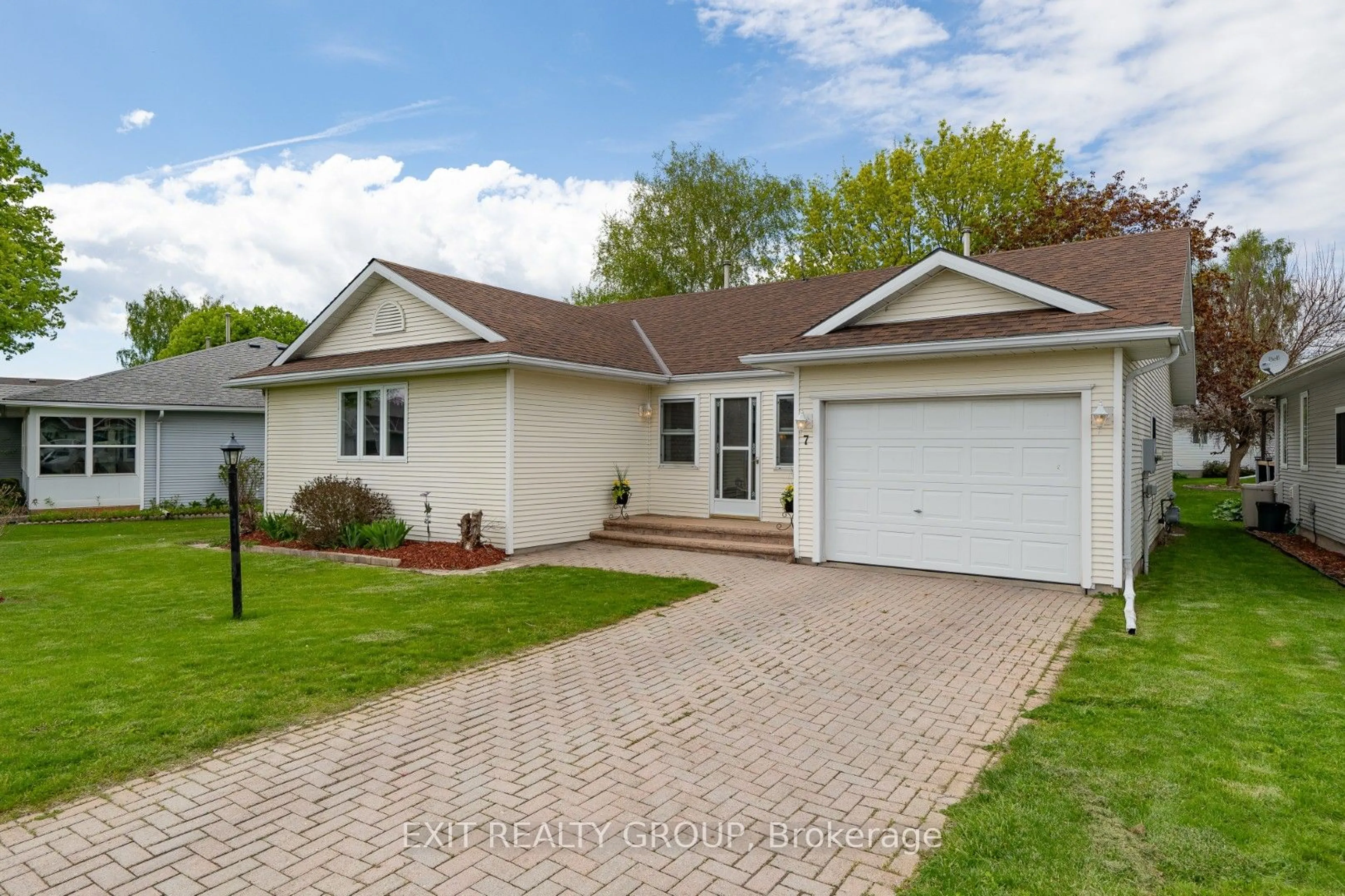 Home with vinyl exterior material, street for 7 Cretney Dr, Prince Edward County Ontario K0K 3L0