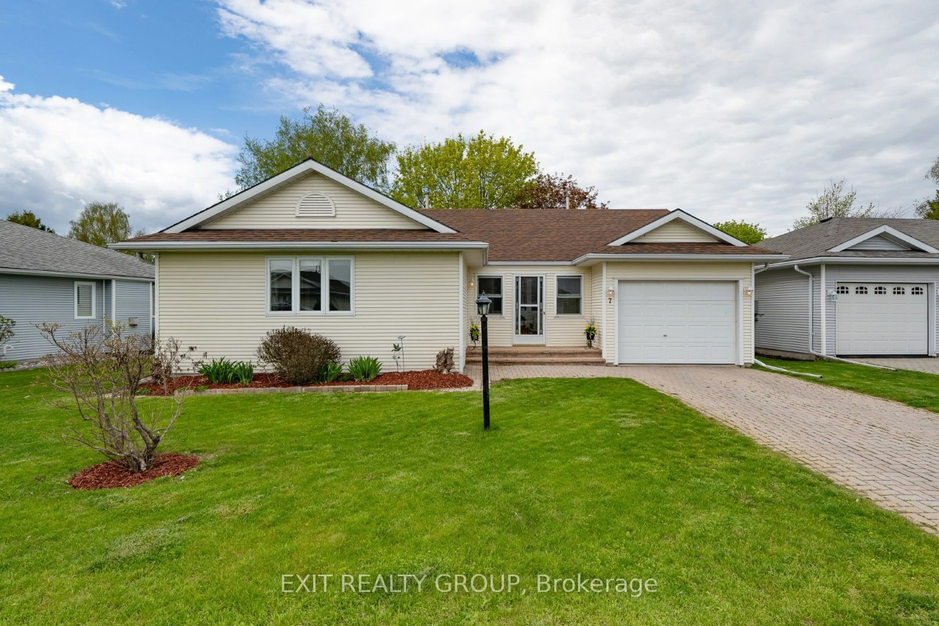 Home with vinyl exterior material, street for 7 Cretney Dr, Prince Edward County Ontario K0K 3L0