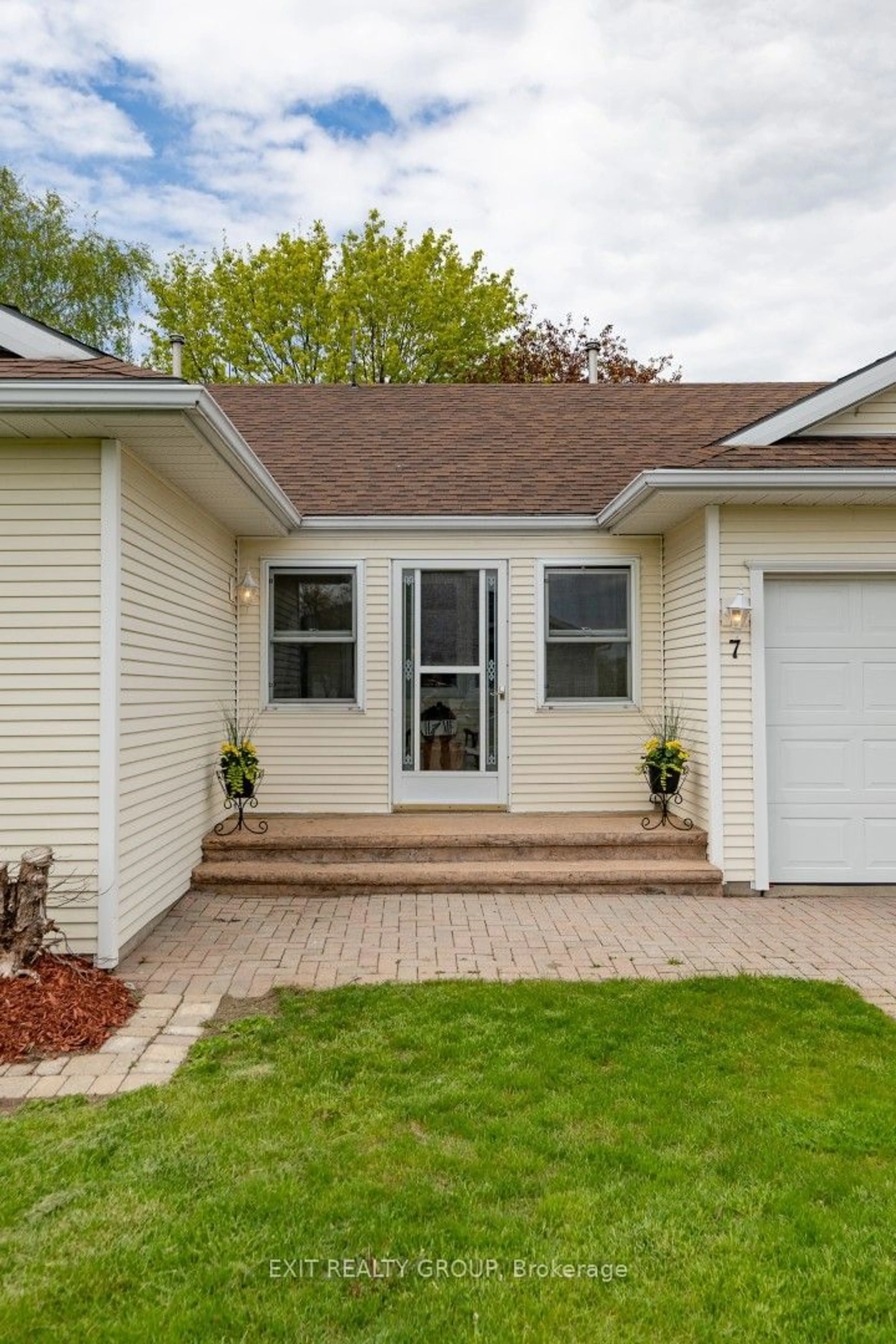 Home with vinyl exterior material, street for 7 Cretney Dr, Prince Edward County Ontario K0K 3L0