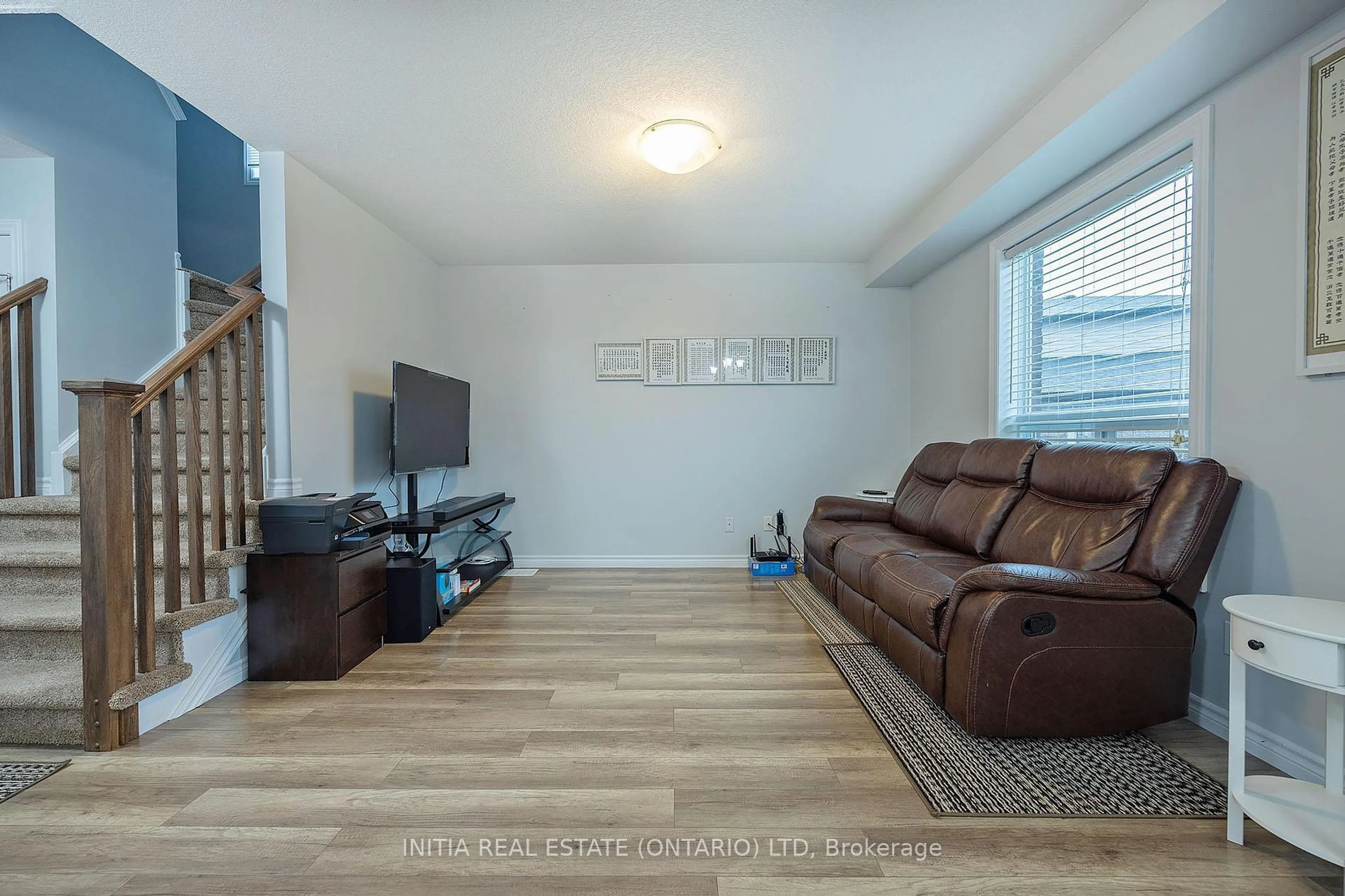 Living room with furniture, wood/laminate floor for 2711 Foxbend Link, London Ontario N6G 5B4