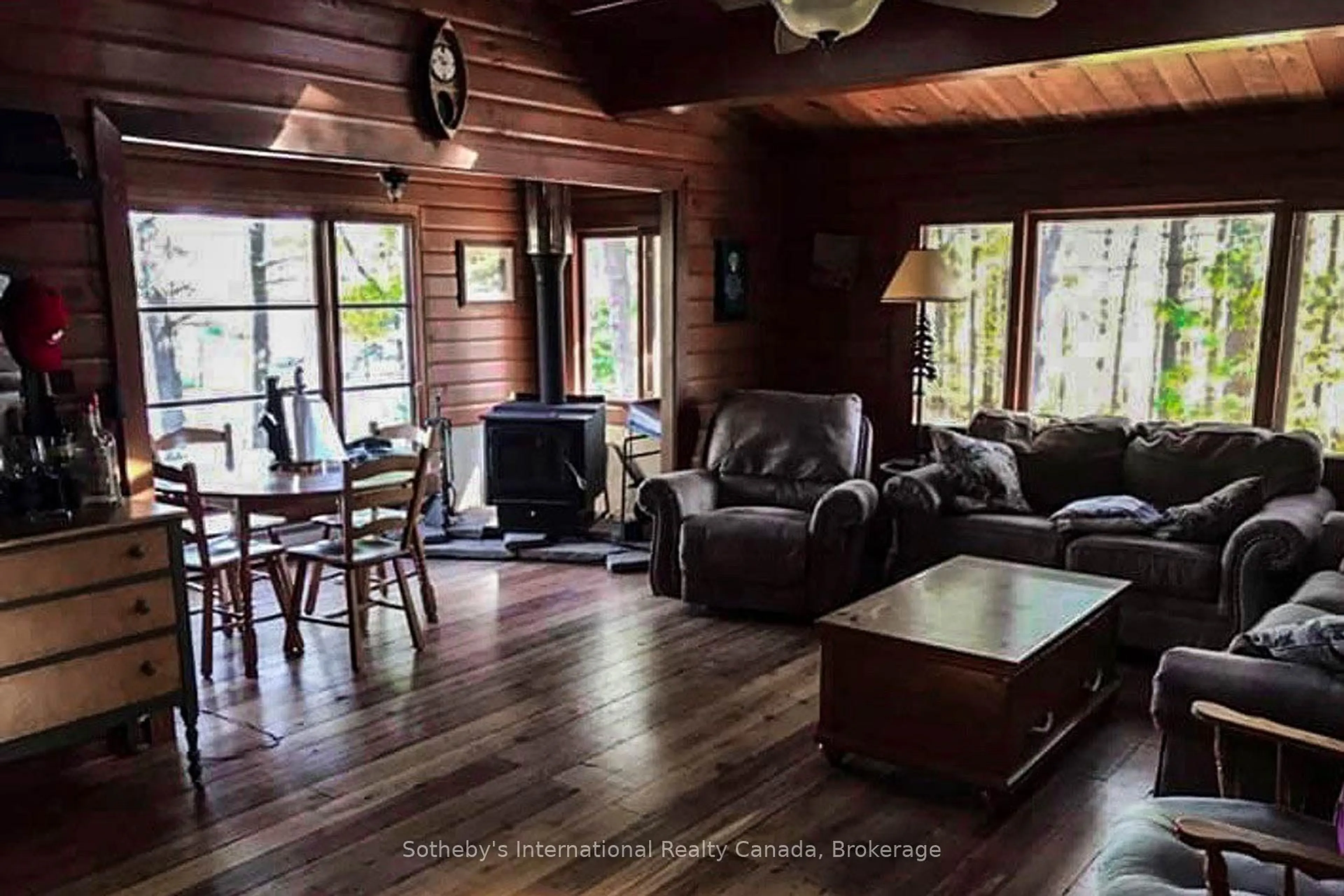 Living room with furniture, wood/laminate floor for 6198 Go Home Lake Shr, Georgian Bay Ontario L0K 1S0