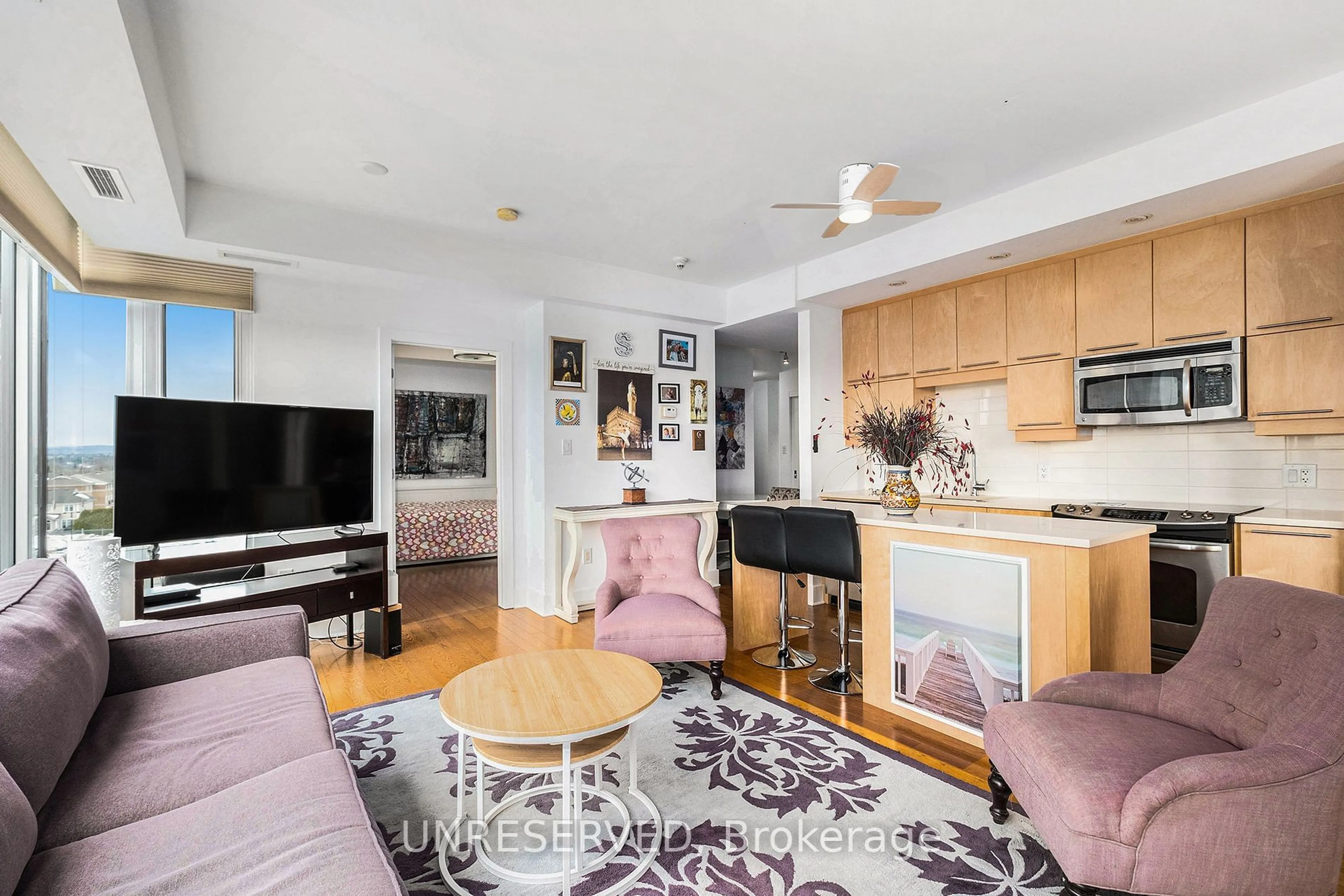 Living room with furniture, unknown for 101 Richmond Rd #406, Tunneys Pasture and Ottawa West Ontario K1Z 0A6