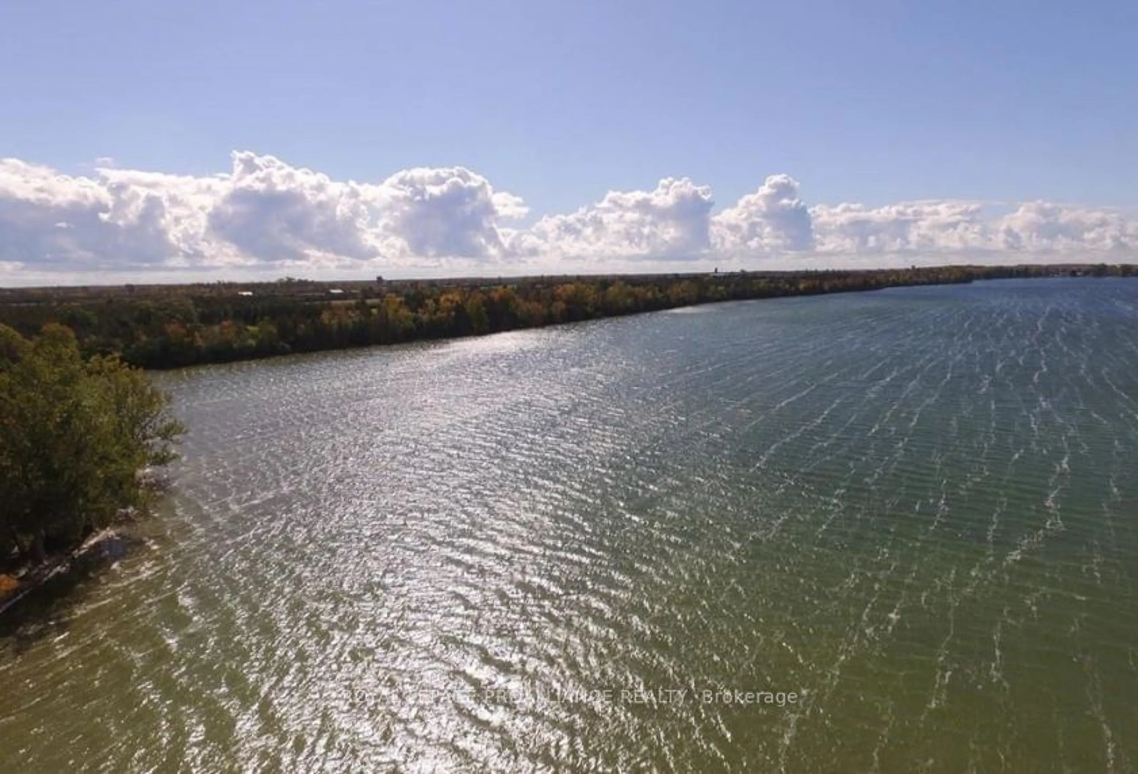 A pic from outside/outdoor area/front of a property/back of a property/a pic from drone, water/lake/river/ocean view for 117 Juniper Lane, Prince Edward County Ontario K0K 1A0