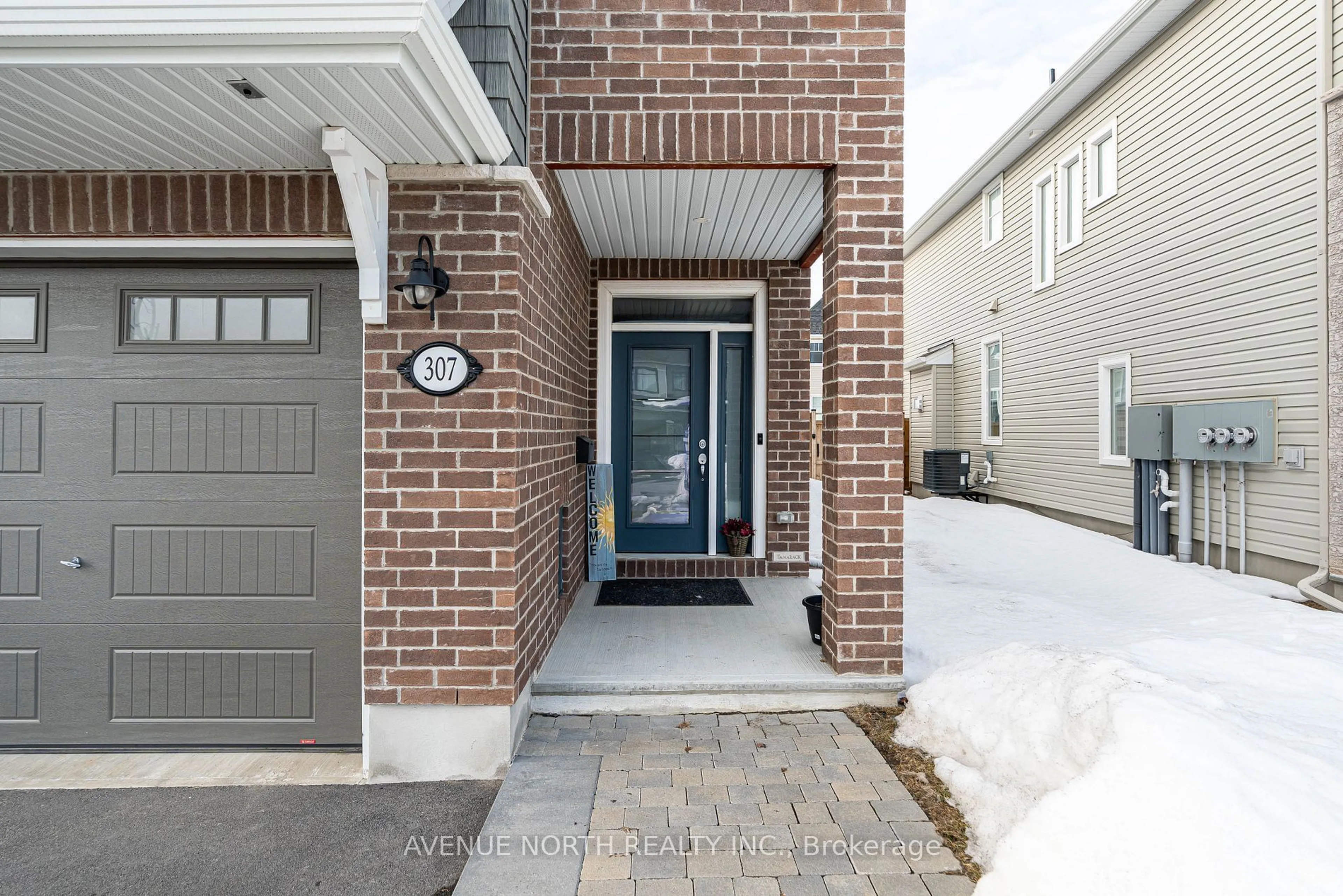 Home with brick exterior material, street for 307 Cosanti Dr, Stittsville - Munster - Richmond Ontario K2S 2L1