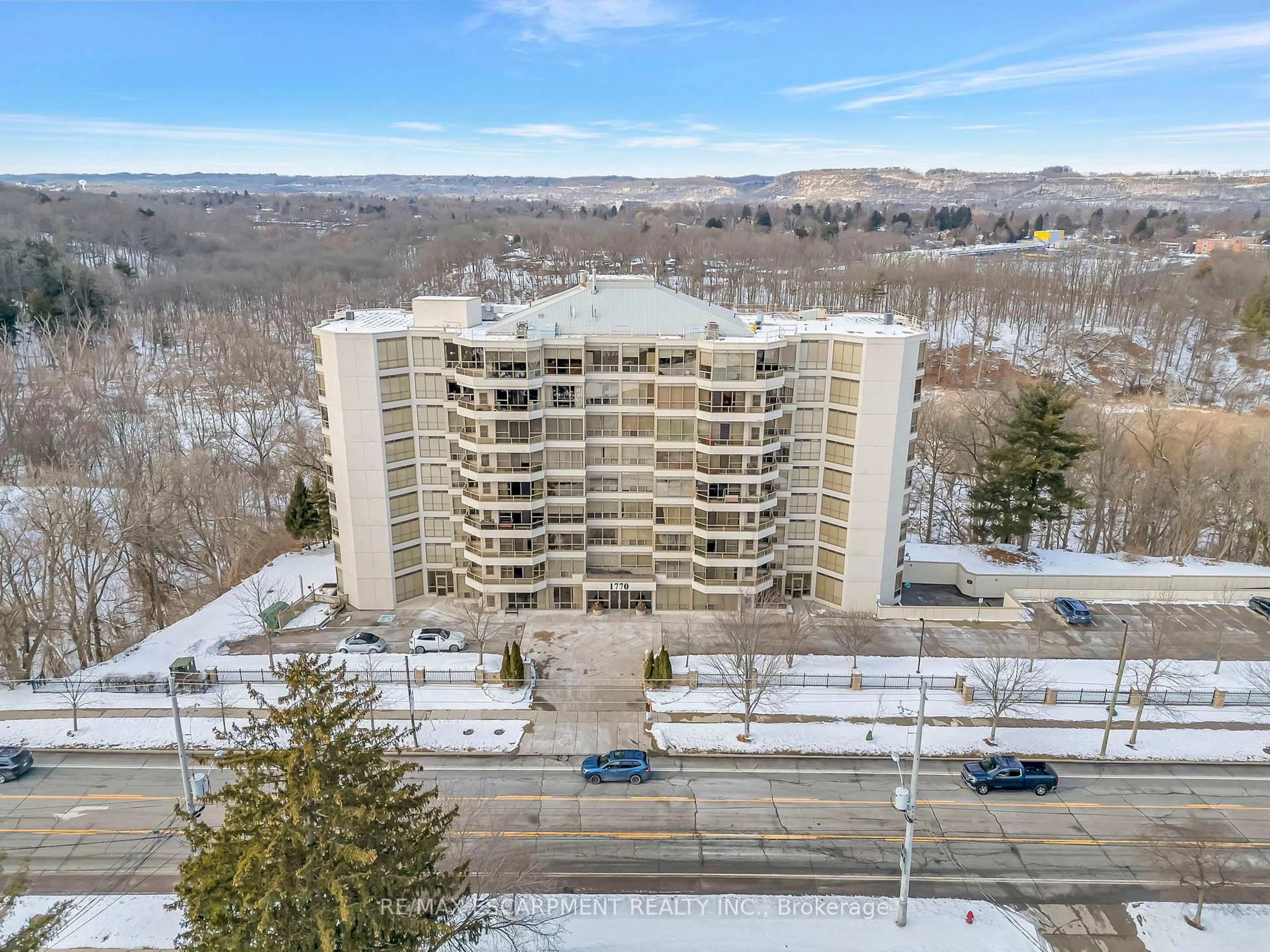 A pic from outside/outdoor area/front of a property/back of a property/a pic from drone, mountain view for 1770 Main St #506, Hamilton Ontario L8S 1H1