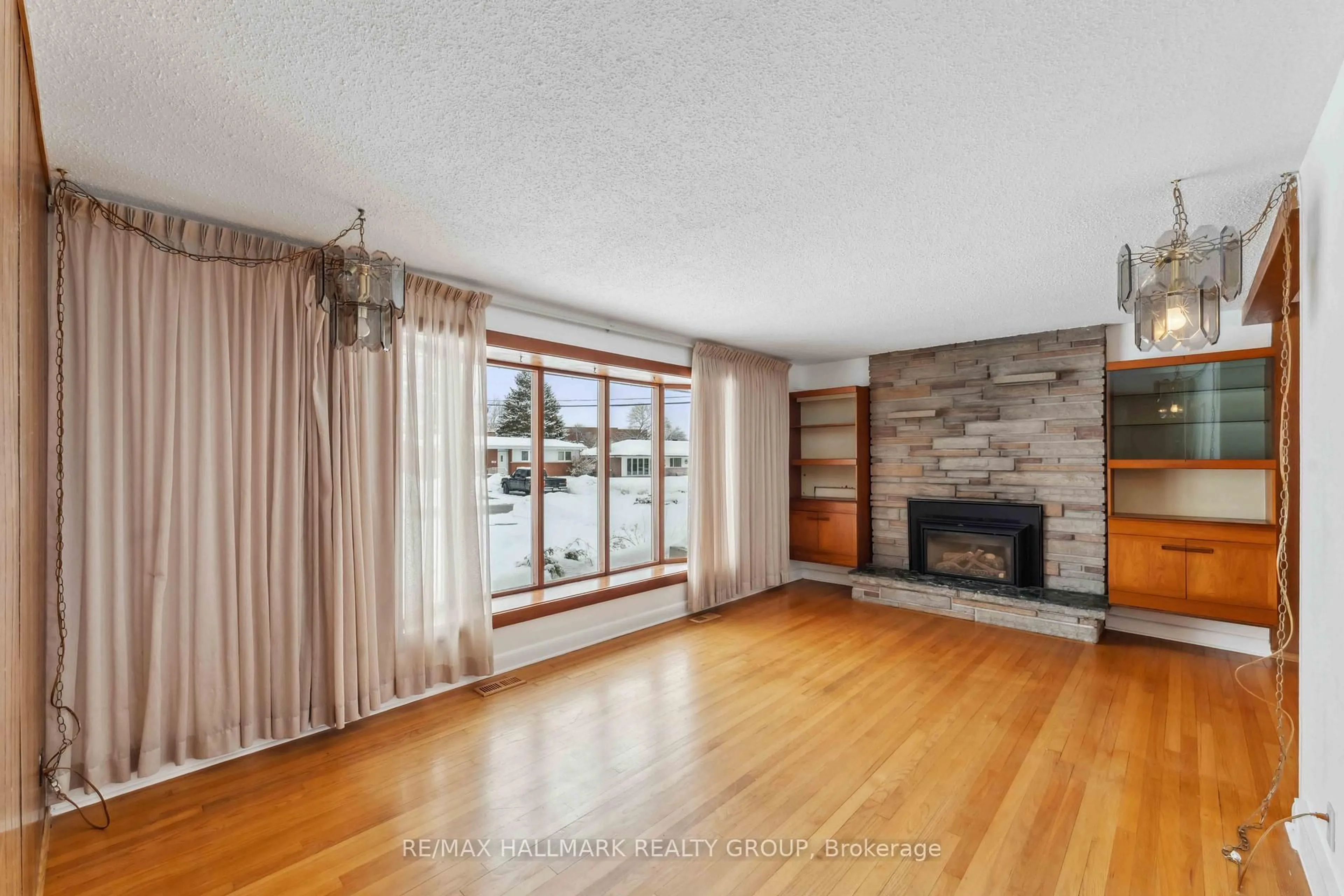 Living room with furniture, wood/laminate floor for 48 Glenridge Rd, Ottawa Ontario K2G 2Z7