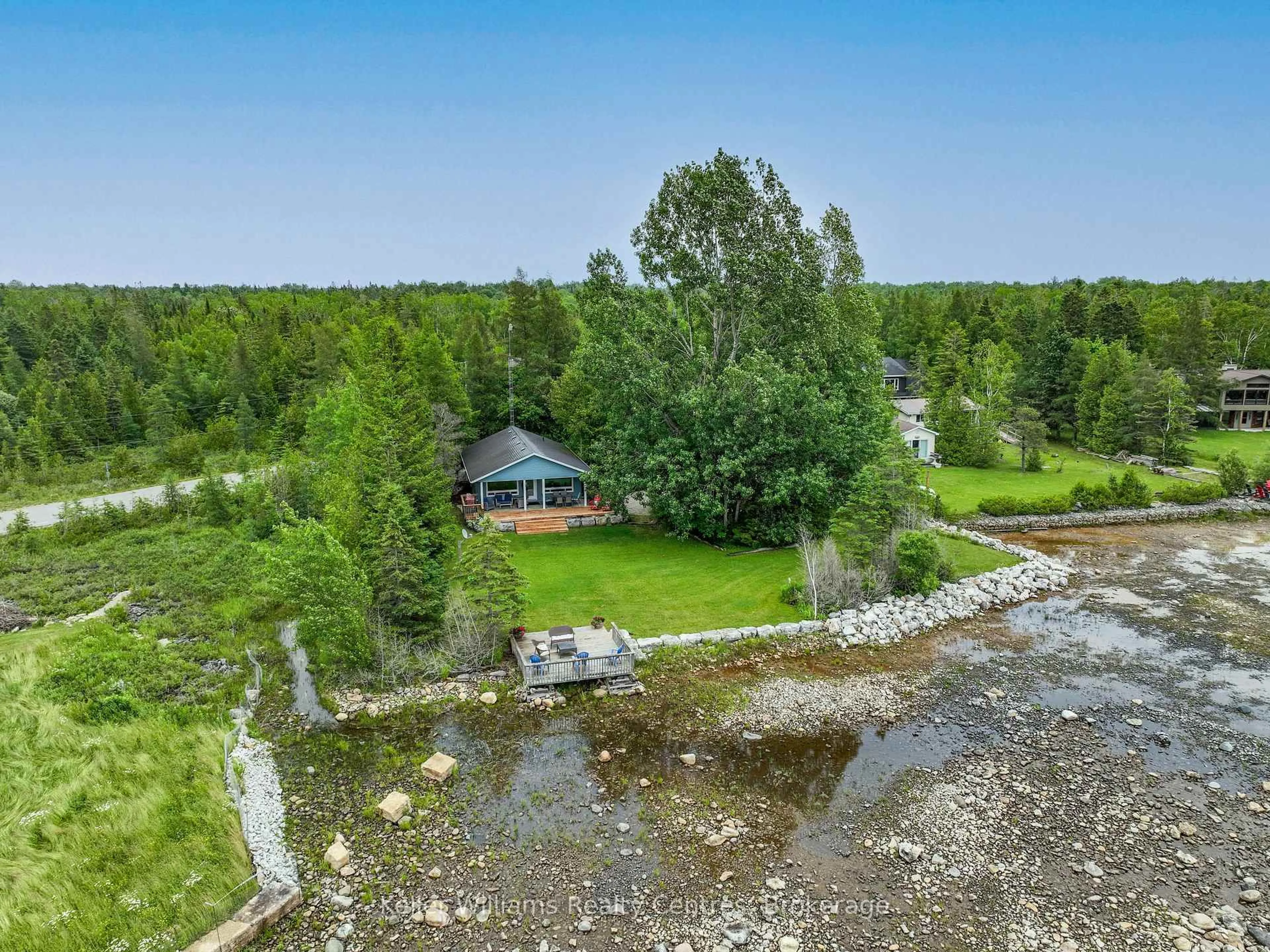 A pic from outside/outdoor area/front of a property/back of a property/a pic from drone, water/lake/river/ocean view for 1208 SUNSET Dr, South Bruce Peninsula Ontario N0H 2T0