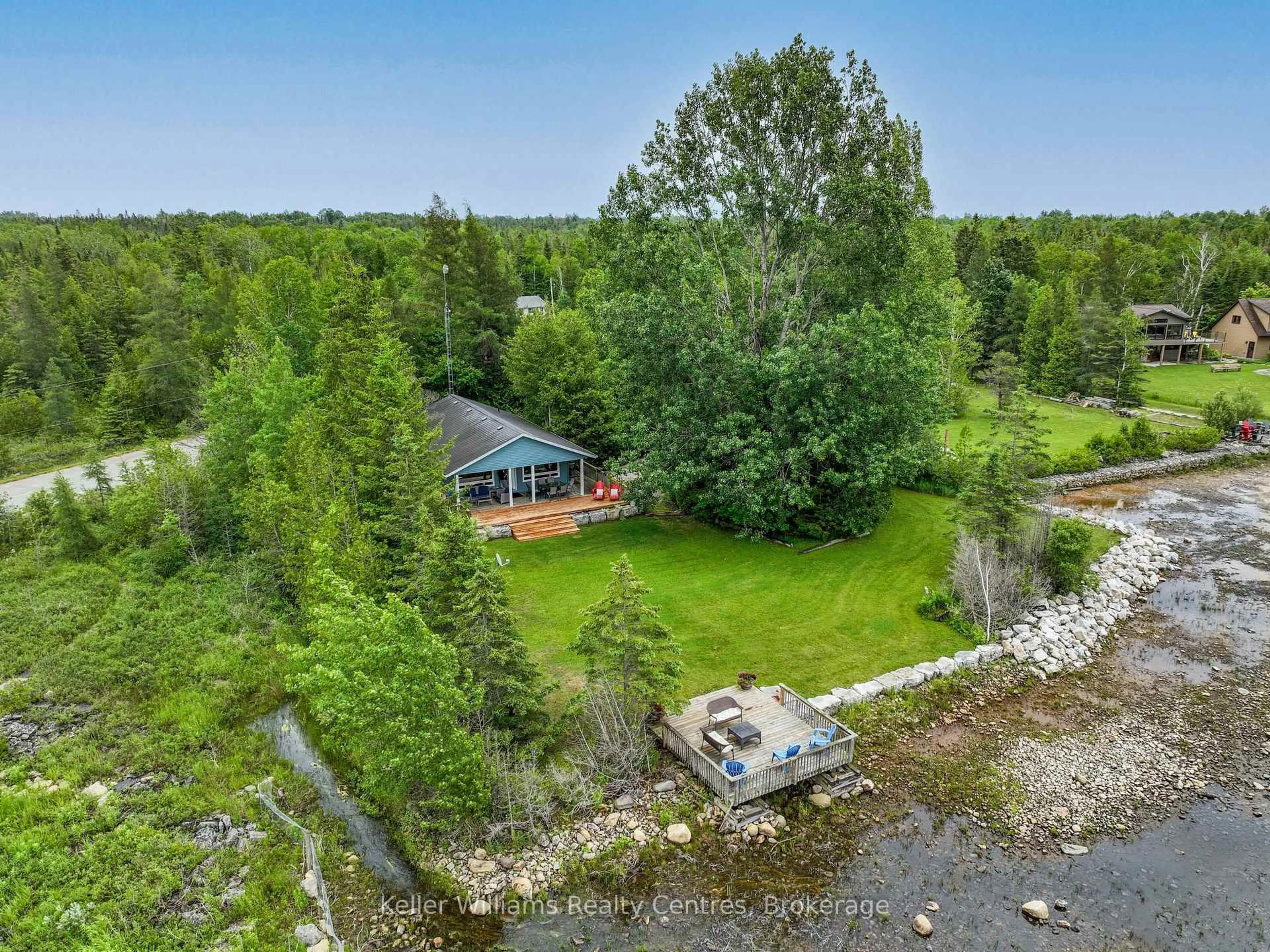 A pic from outside/outdoor area/front of a property/back of a property/a pic from drone, water/lake/river/ocean view for 1208 SUNSET Dr, South Bruce Peninsula Ontario N0H 2T0