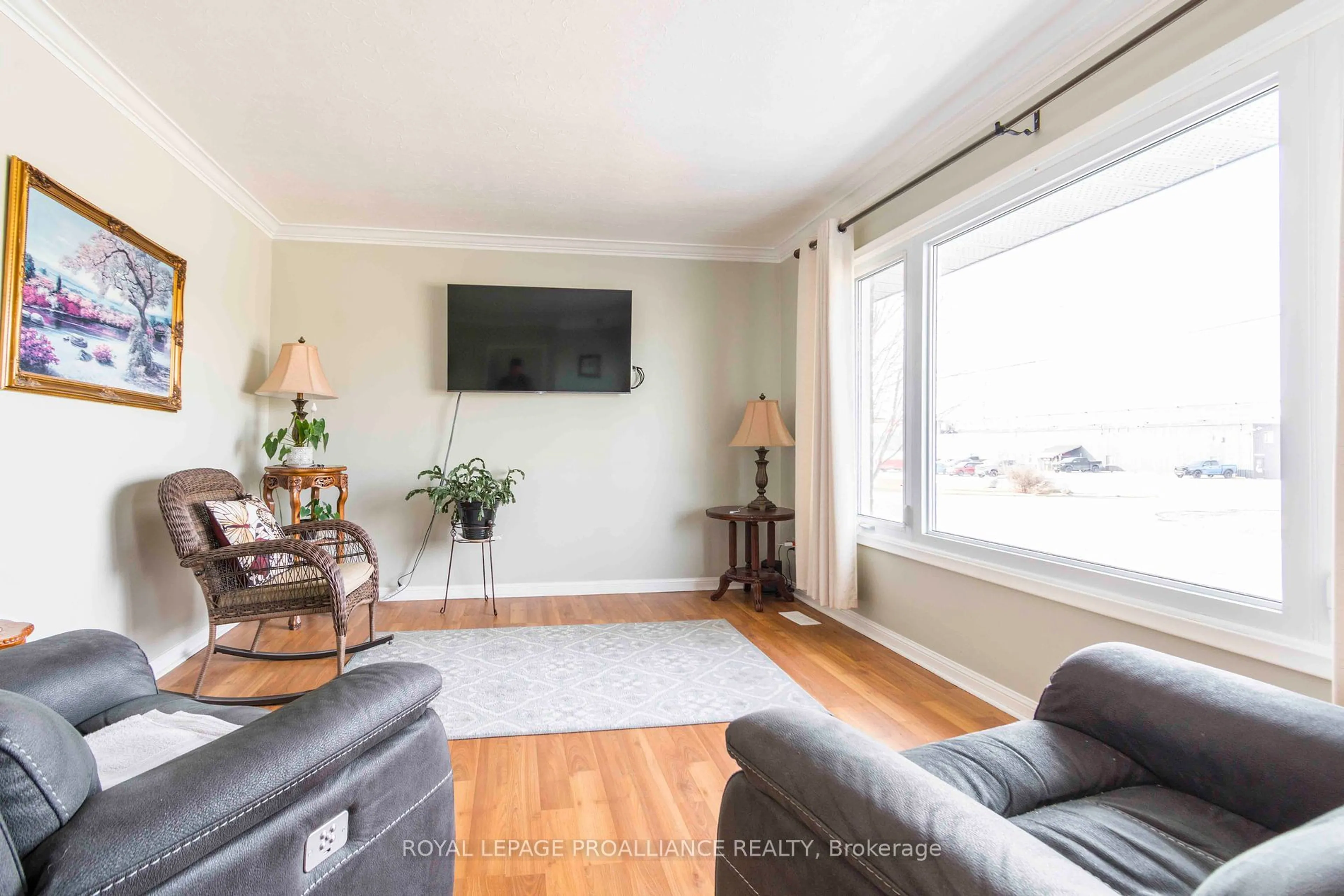 Living room with furniture, wood/laminate floor for 249 West St, Quinte West Ontario K8V 2N2