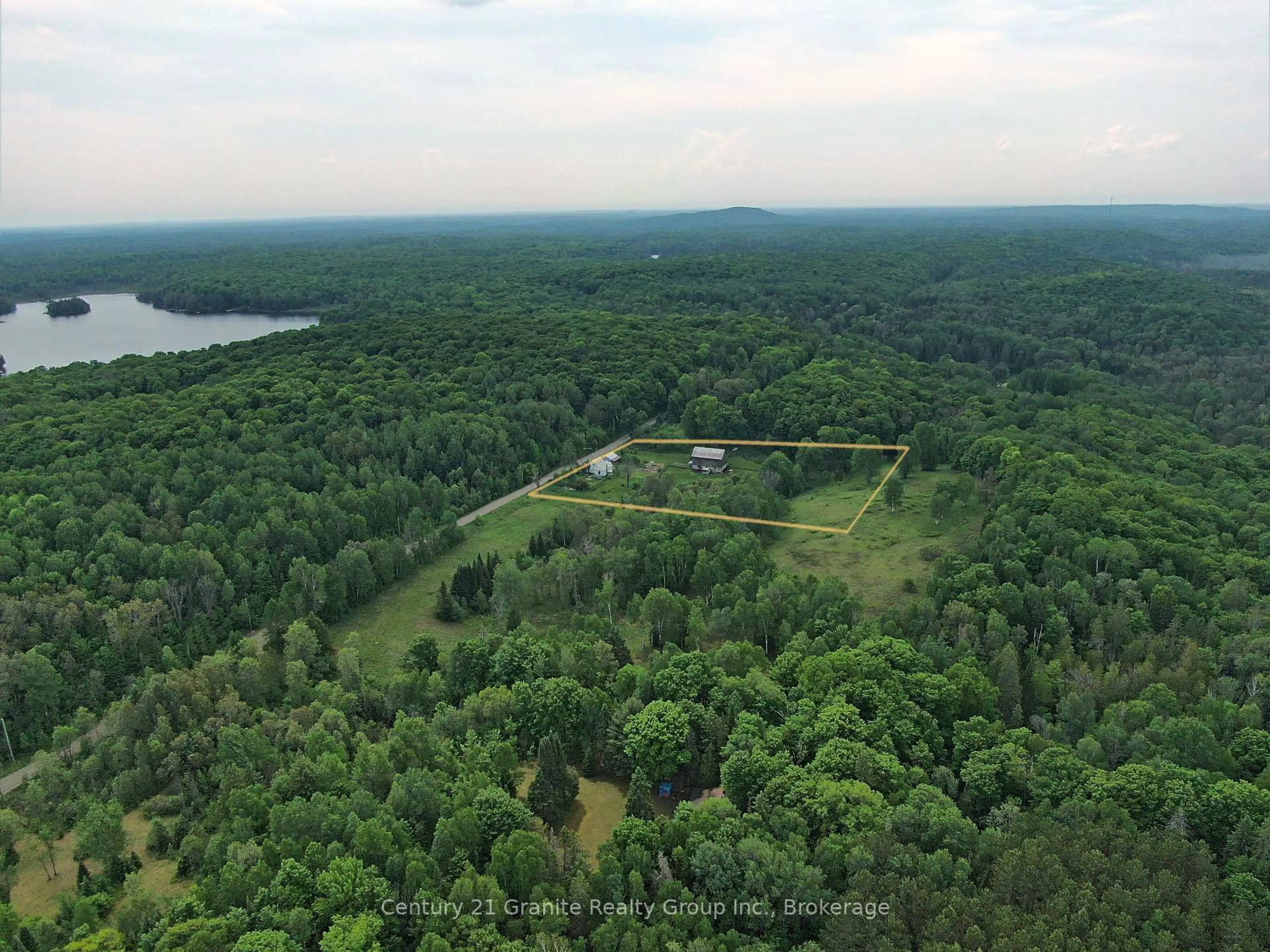 A pic from outside/outdoor area/front of a property/back of a property/a pic from drone, forest/trees view for 1429 Tamarack Lake Rd, Highlands East Ontario K0M 1R0