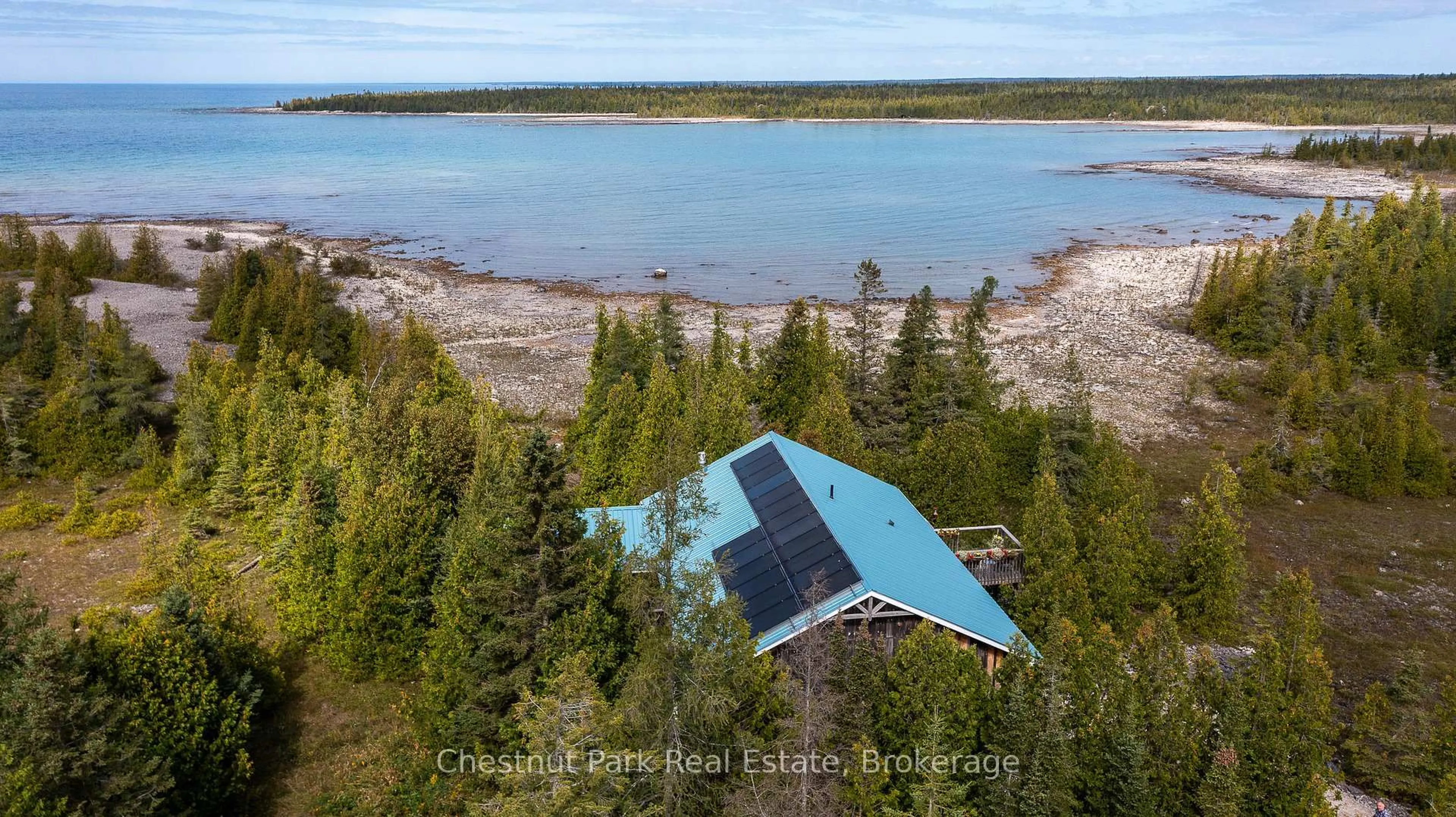 A pic from outside/outdoor area/front of a property/back of a property/a pic from drone, water/lake/river/ocean view for 130 Pine Tree Harbour Rd, Northern Bruce Peninsula Ontario N0H 1Z0