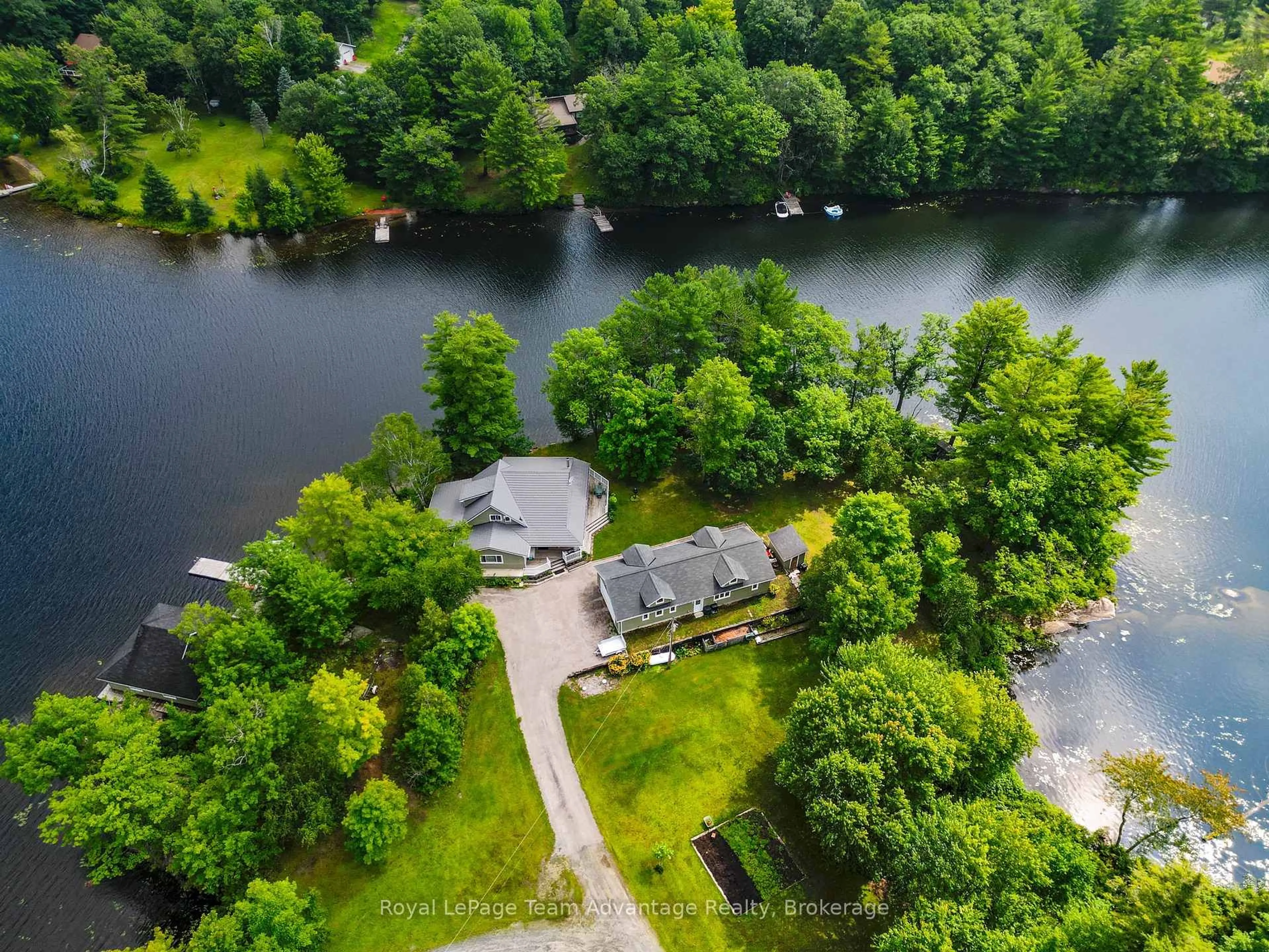 A pic from outside/outdoor area/front of a property/back of a property/a pic from drone, water/lake/river/ocean view for 1078A Lake Joseph Rd, Seguin Ontario P2A 2W8