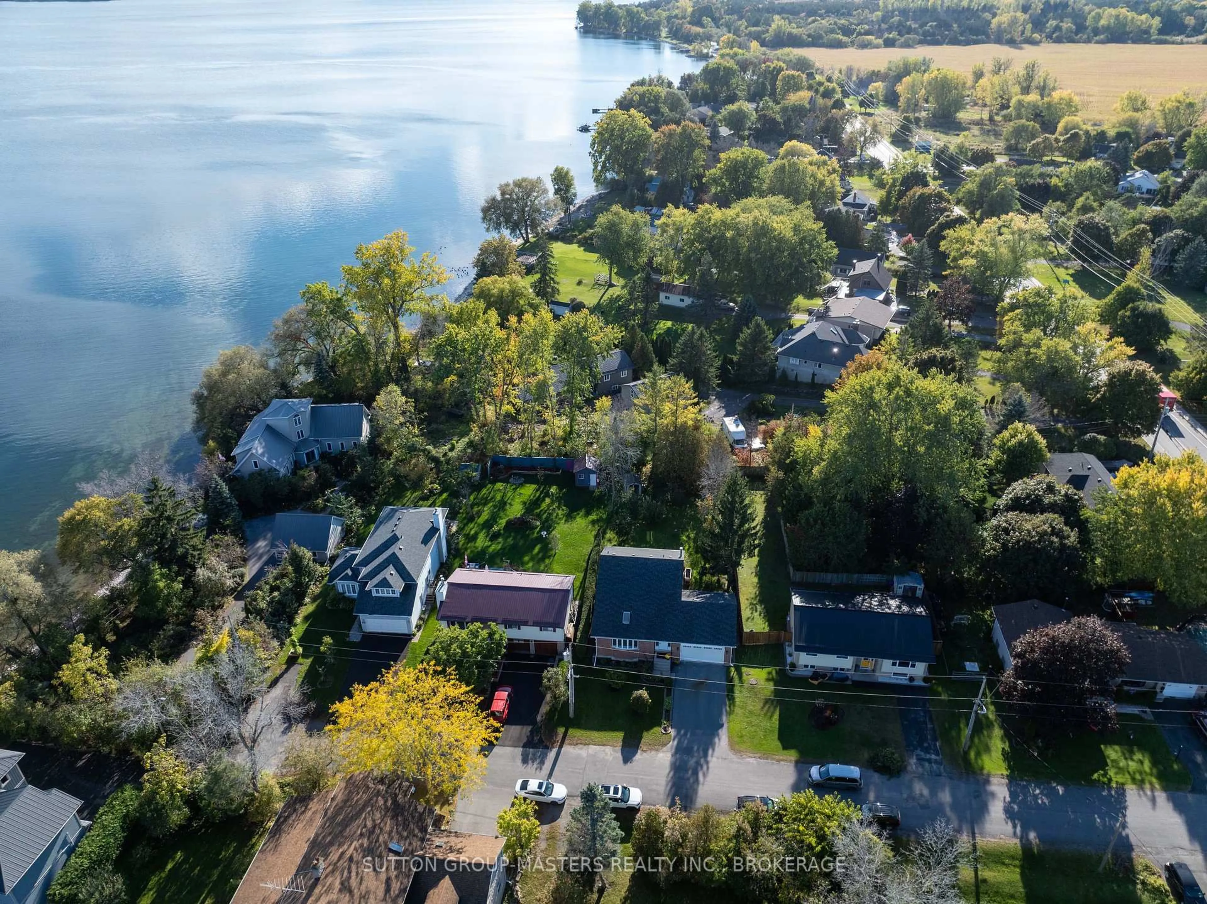 A pic from outside/outdoor area/front of a property/back of a property/a pic from drone, water/lake/river/ocean view for 135 FACTORY Lane, Bath Ontario K0H 1G0