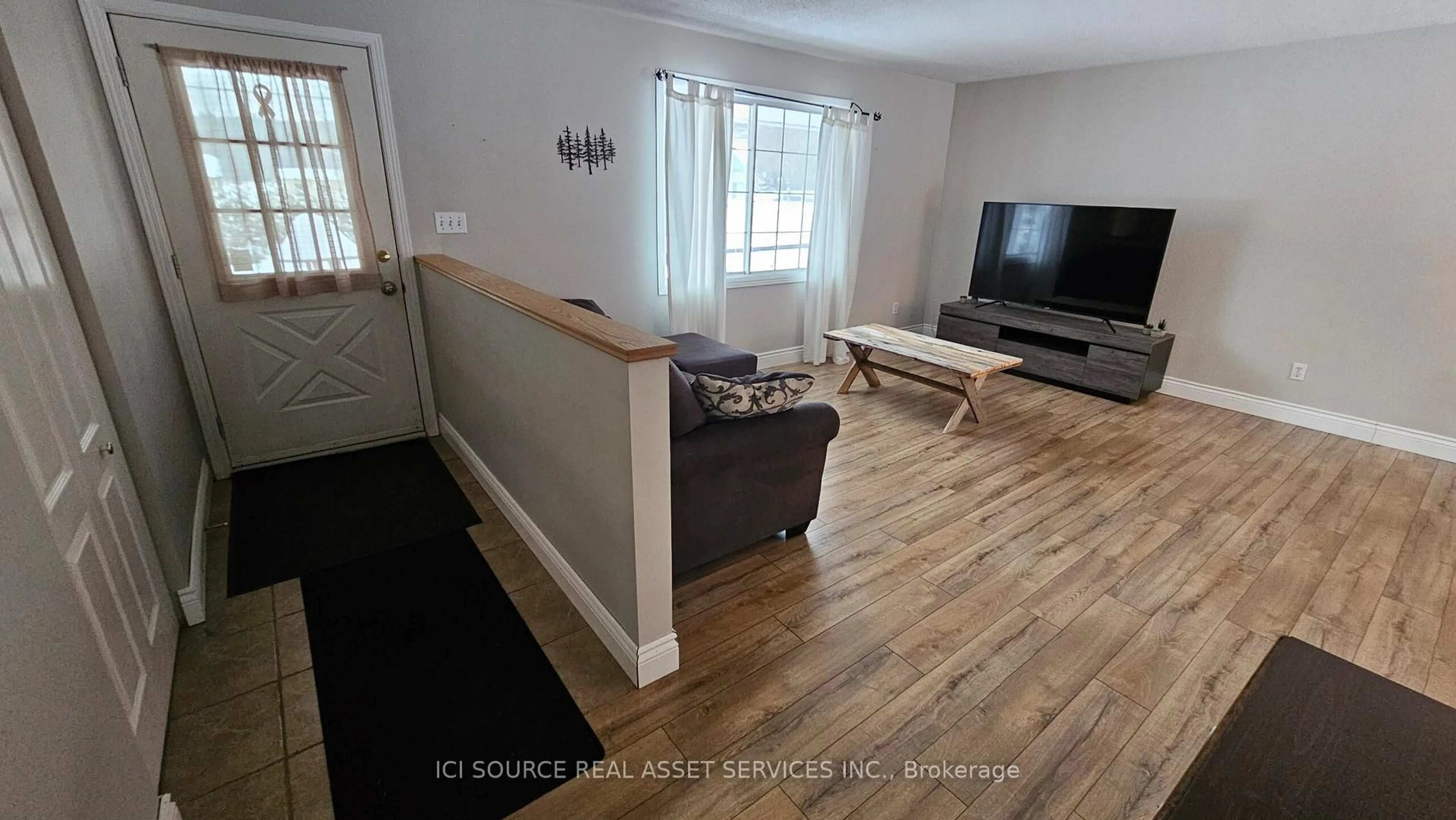 Living room with furniture, wood/laminate floor for 188 Airport Rd, Petawawa Ontario K8A 6W7