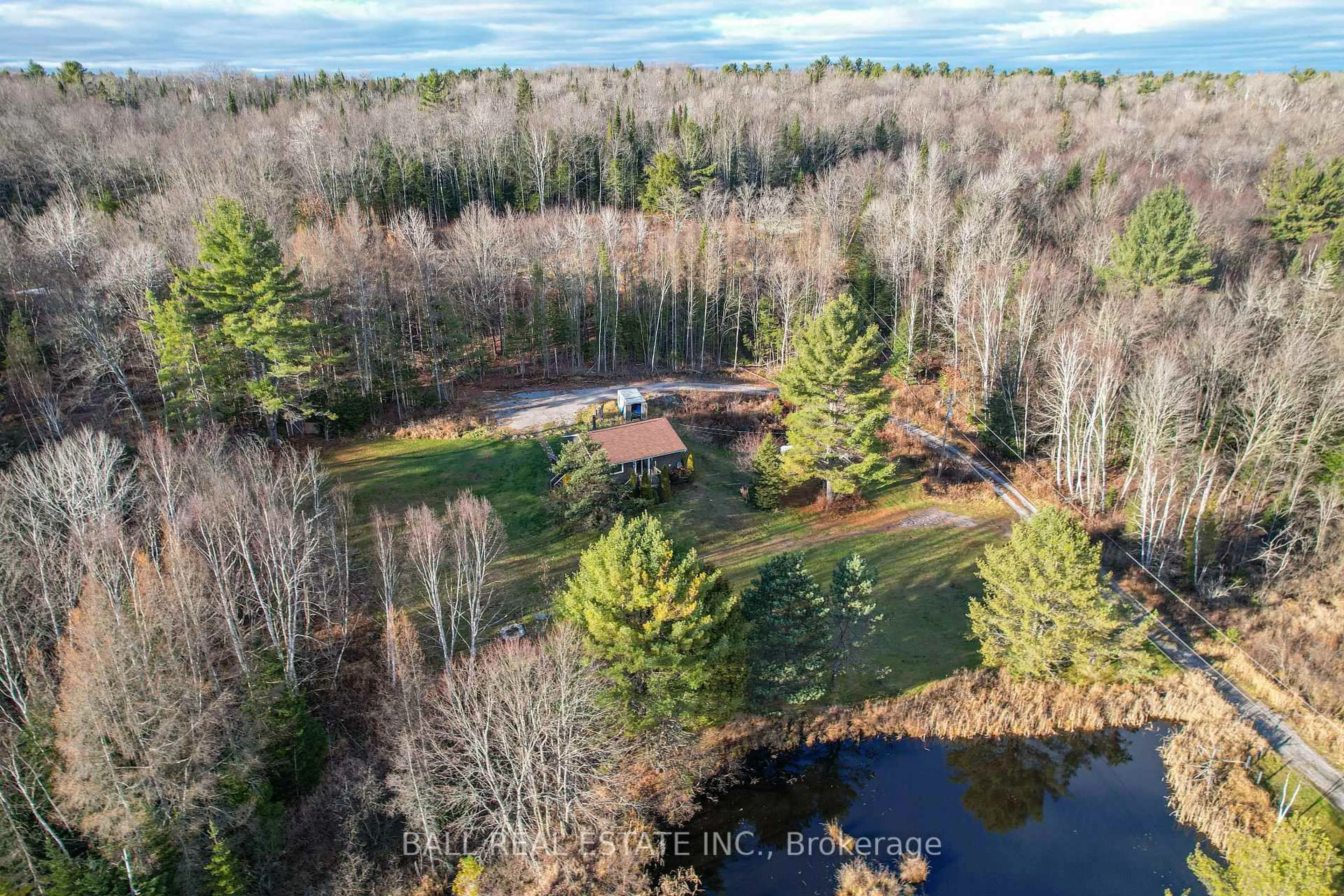 A pic from outside/outdoor area/front of a property/back of a property/a pic from drone, water/lake/river/ocean view for 1047 Donroy Rd, Highlands East Ontario K0M 1R0