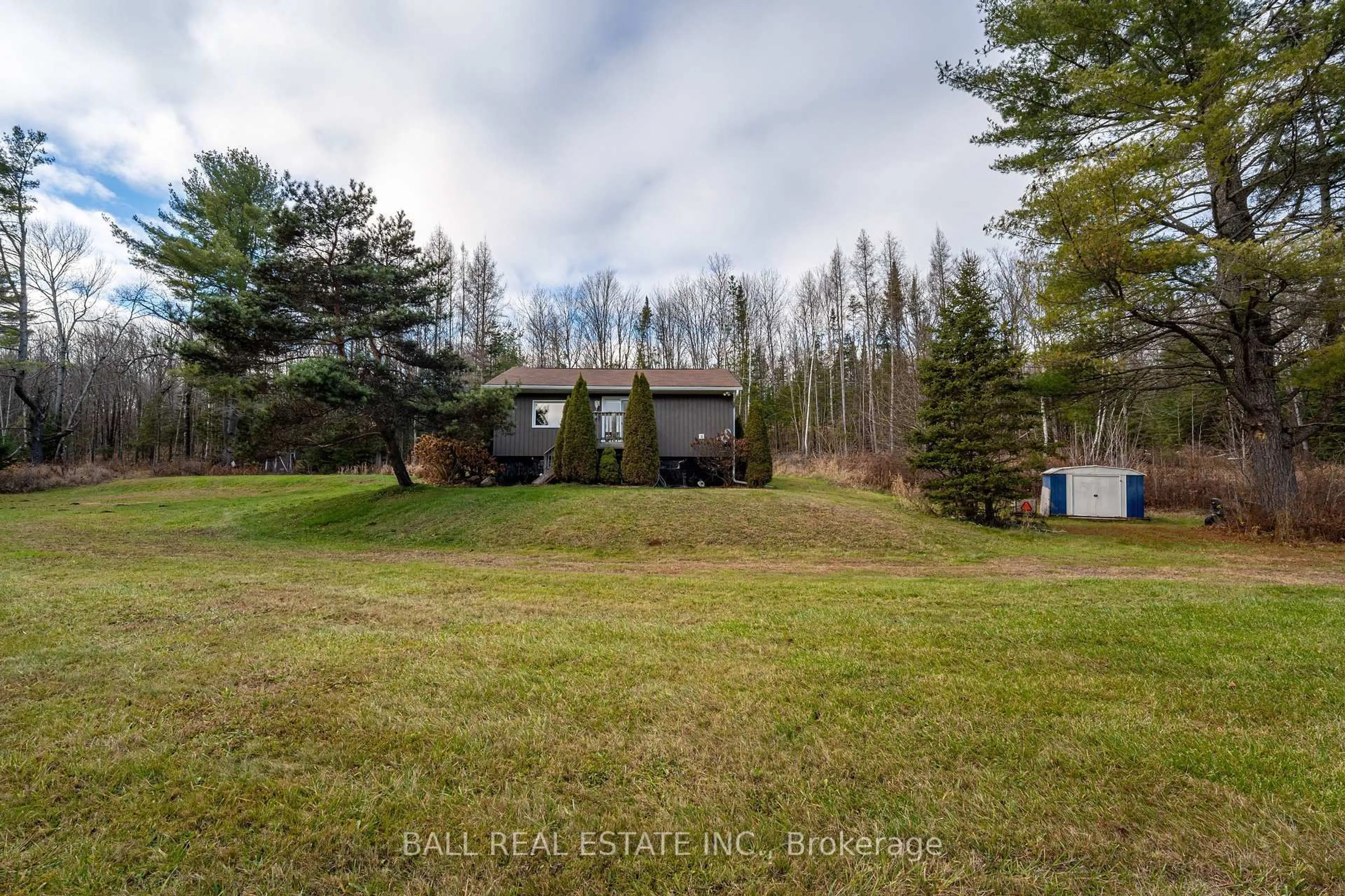 A pic from outside/outdoor area/front of a property/back of a property/a pic from drone, forest/trees view for 1047 Donroy Rd, Highlands East Ontario K0M 1R0