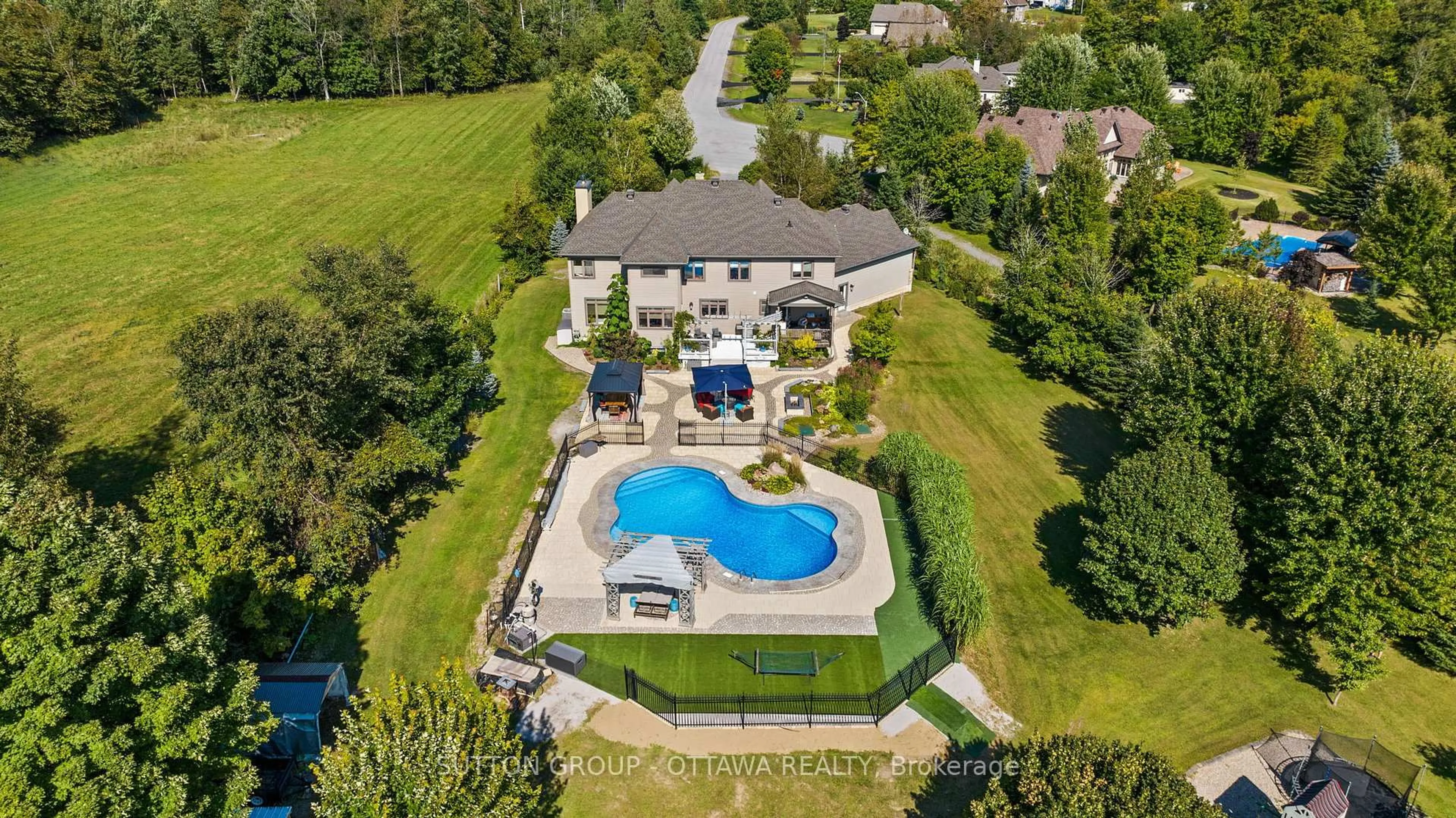 A pic from outside/outdoor area/front of a property/back of a property/a pic from drone, water/lake/river/ocean view for 201 Cyd St, Carp Ontario K0A 1L0