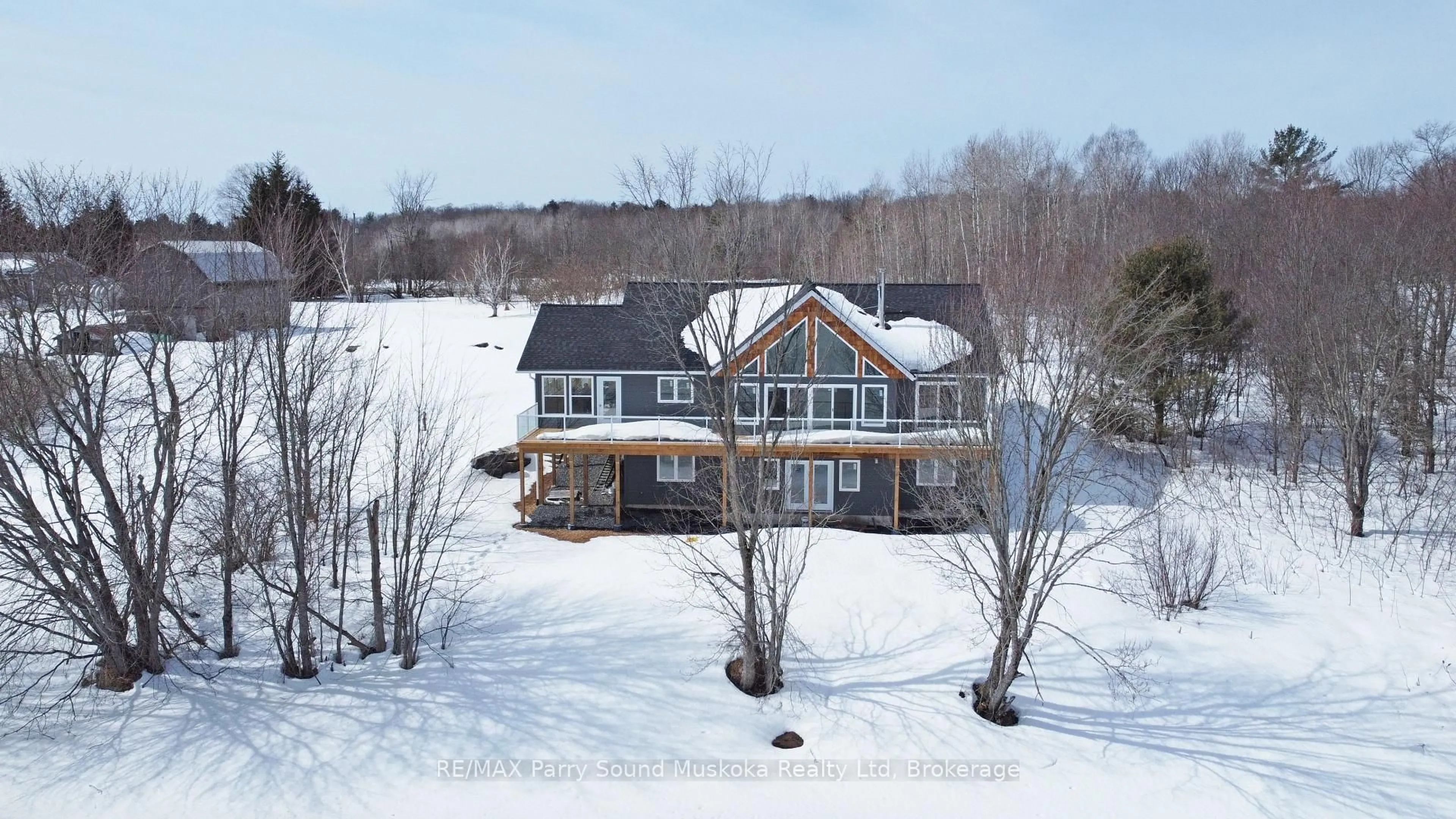 A pic from outside/outdoor area/front of a property/back of a property/a pic from drone, water/lake/river/ocean view for 49 Hardies Rd, McKellar Ontario P2A 0B5