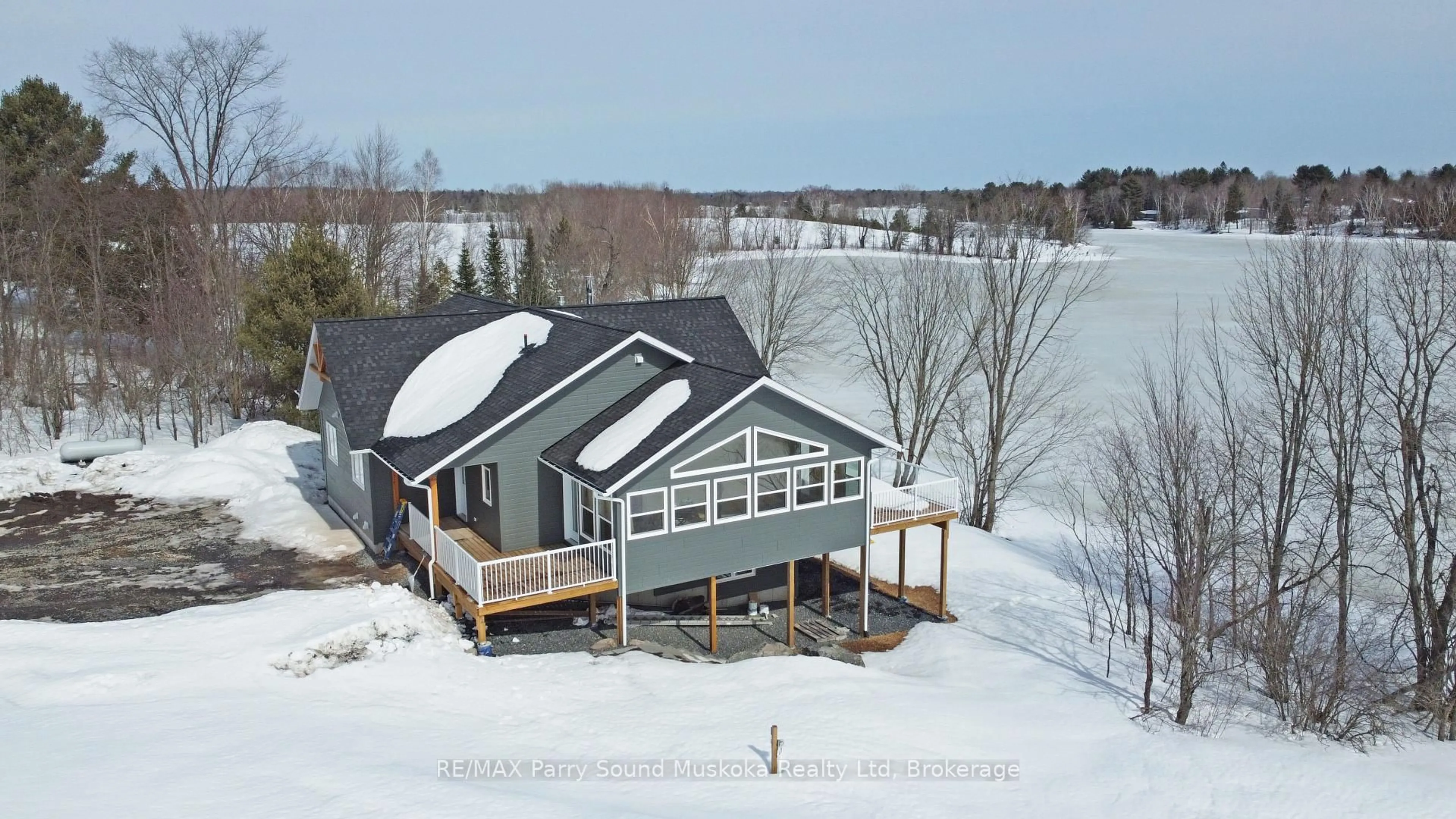 A pic from outside/outdoor area/front of a property/back of a property/a pic from drone, water/lake/river/ocean view for 49 Hardies Rd, McKellar Ontario P2A 0B5