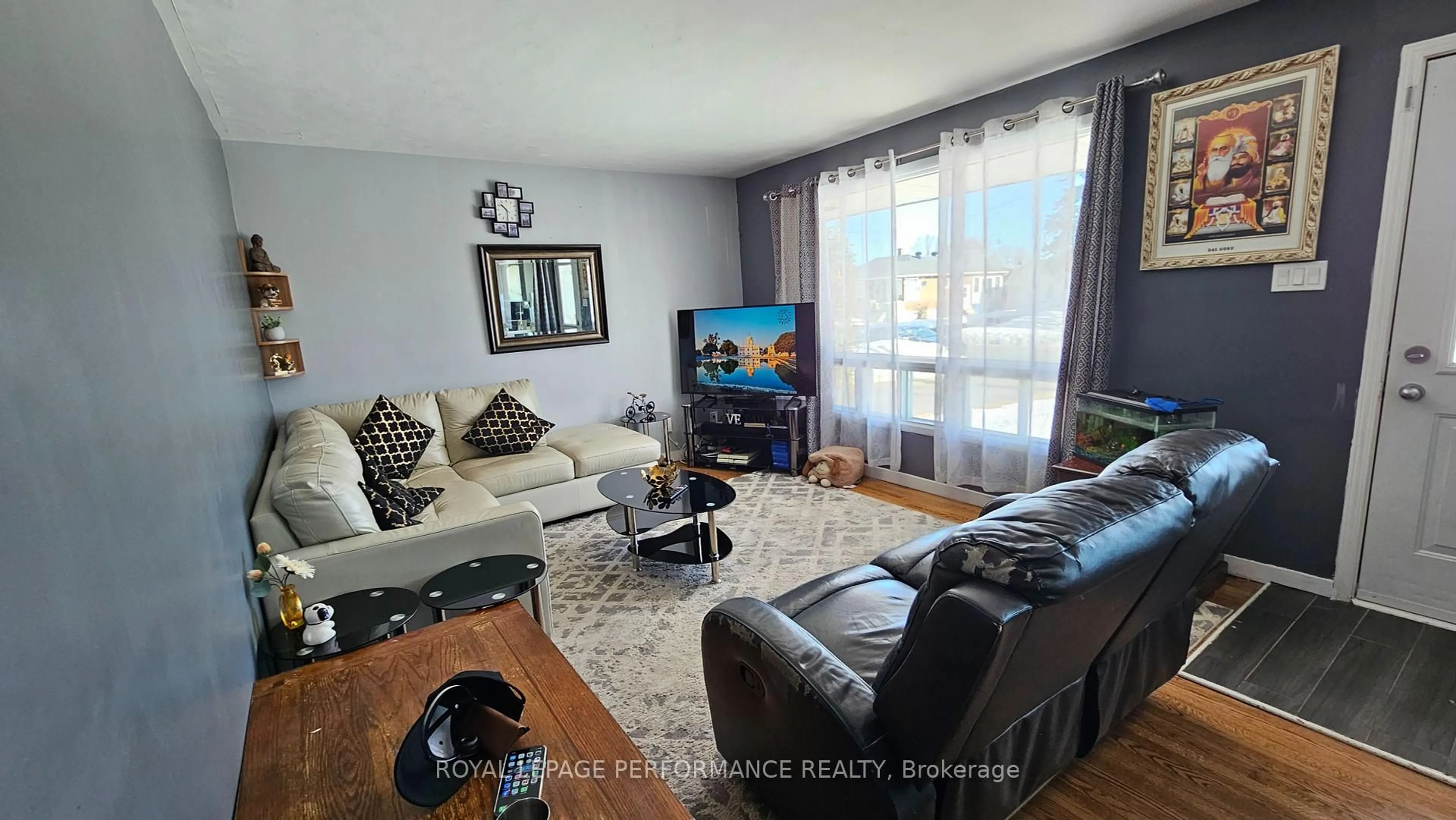 Living room with furniture, wood/laminate floor for 1208 Henry St, Cornwall Ontario K6J 5A6
