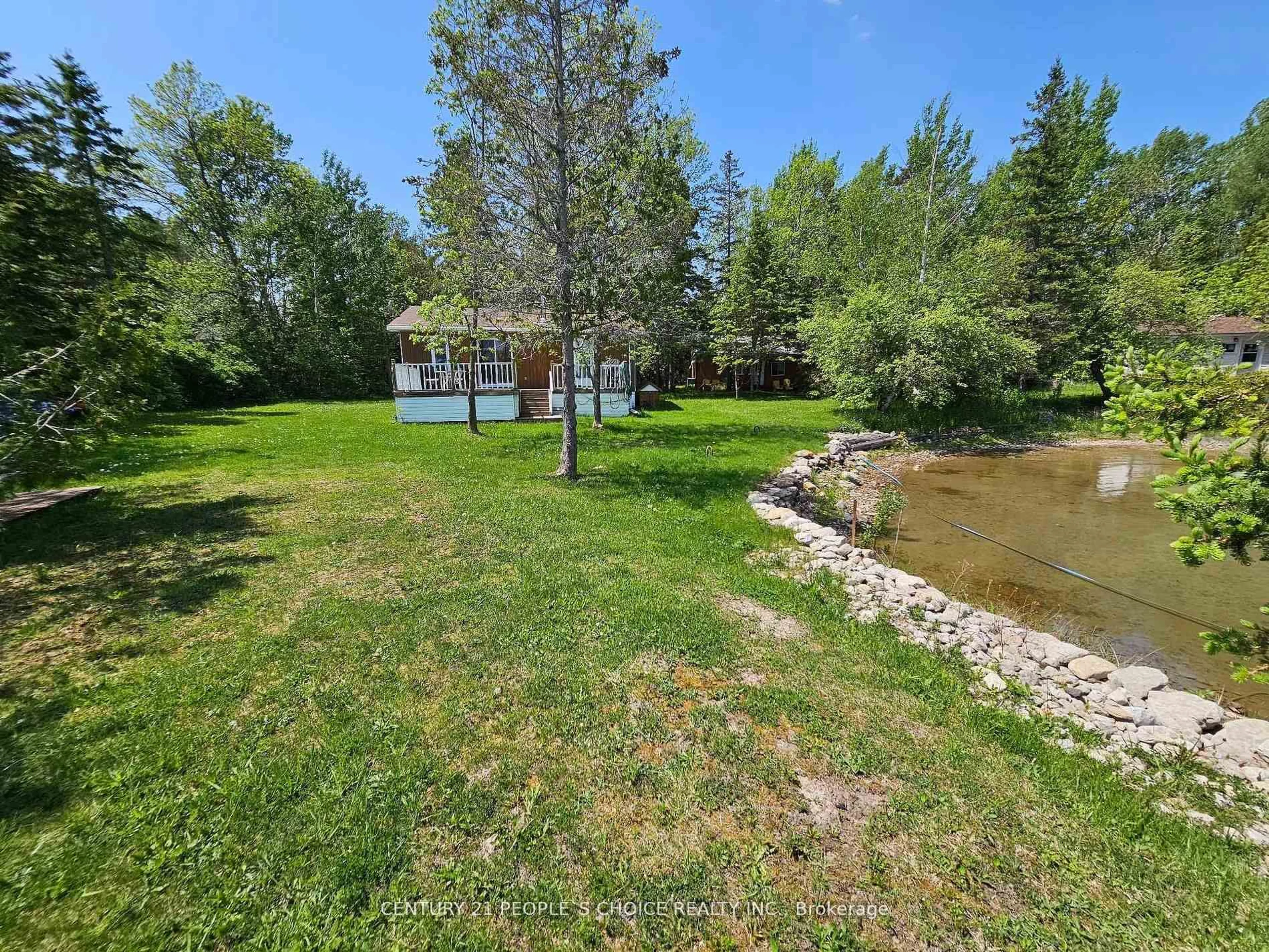 A pic from outside/outdoor area/front of a property/back of a property/a pic from drone, water/lake/river/ocean view for 123 Waterview Lane, Assiginack Ontario P0P 1N0