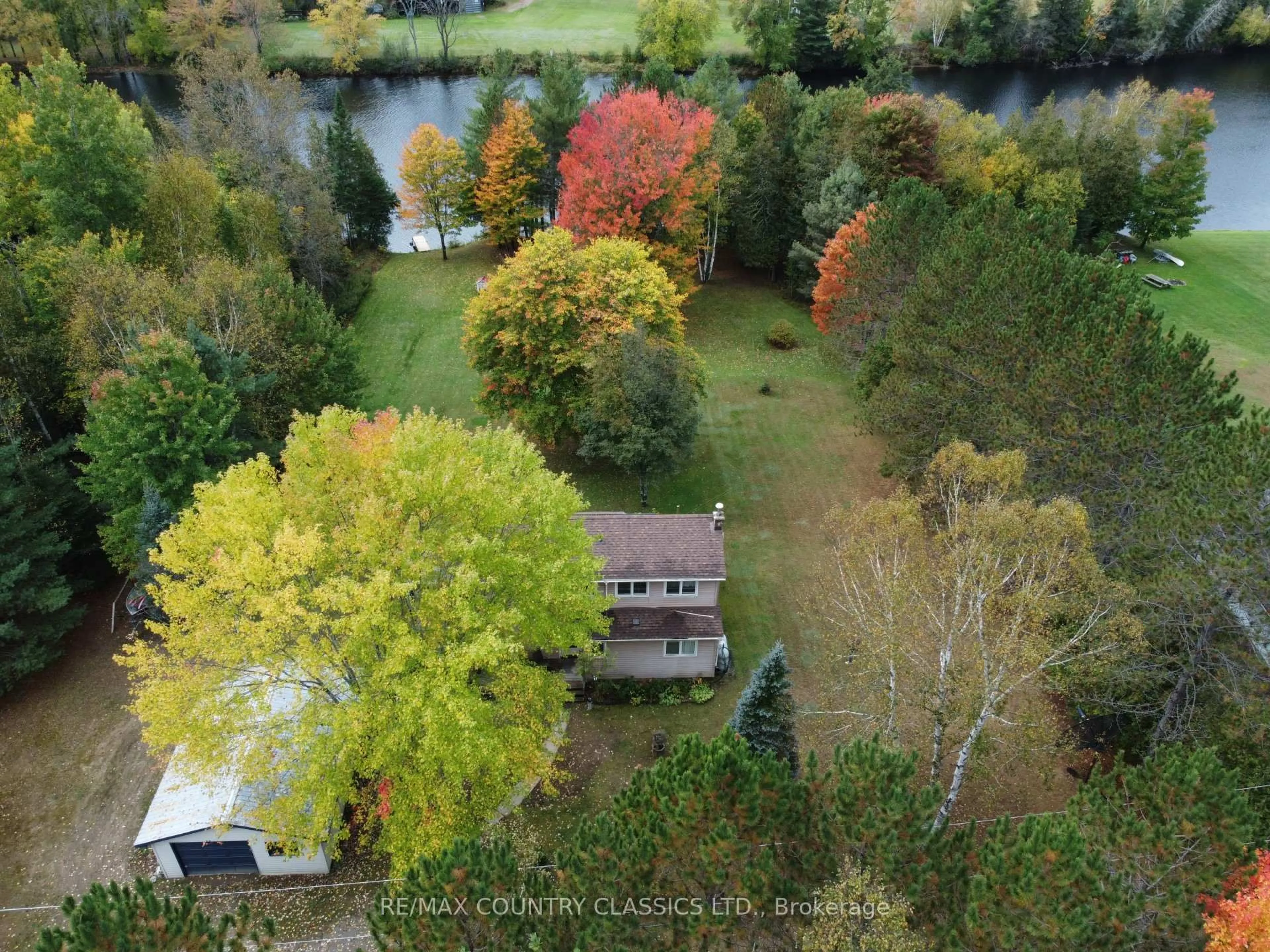 A pic from outside/outdoor area/front of a property/back of a property/a pic from drone, water/lake/river/ocean view for 36 Crescent Dr, Palmer Rapids Ontario K0J 2E0