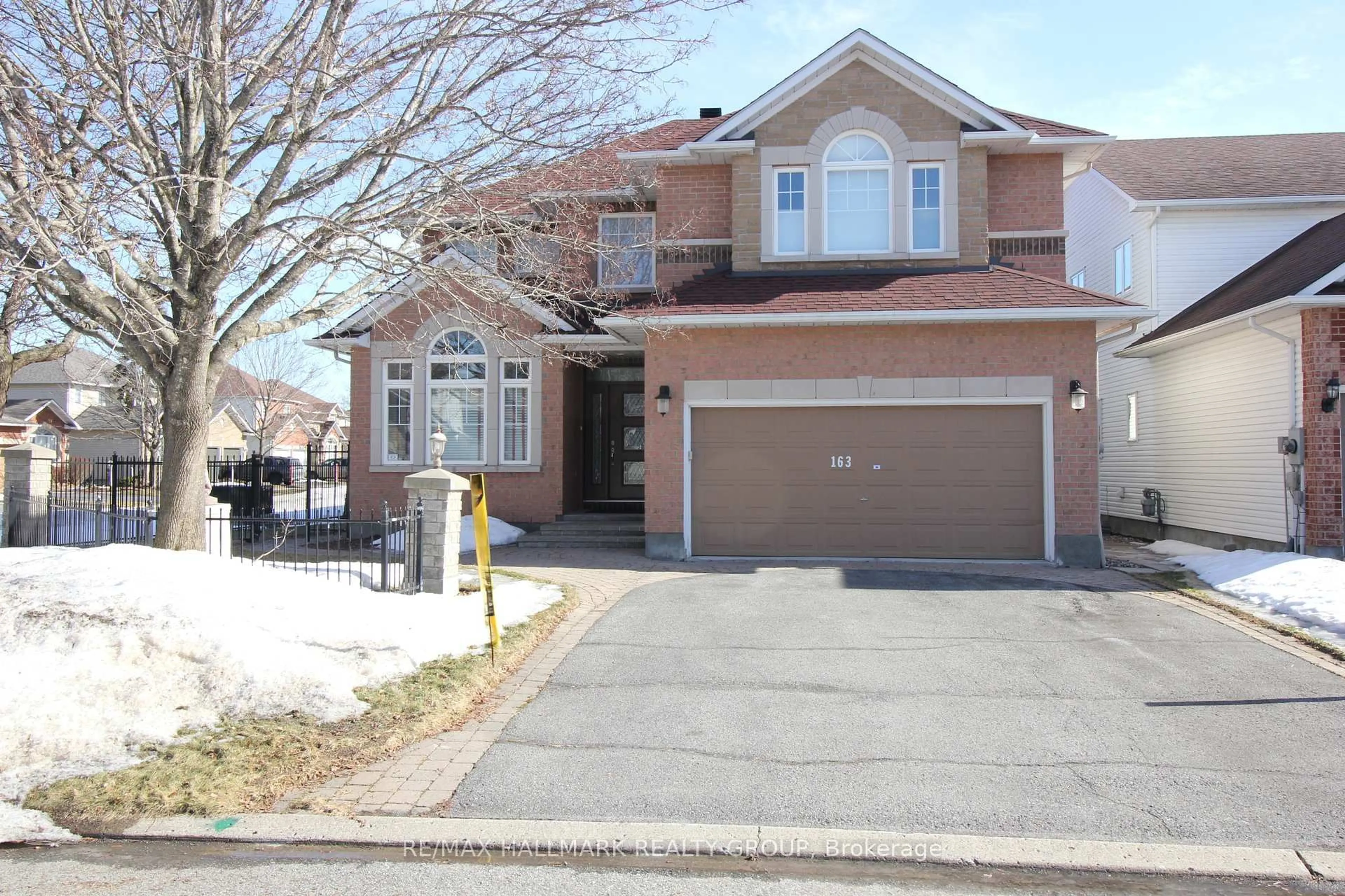 Home with brick exterior material, street for 163 Yoho Dr, Kanata Ontario K2M 2V4