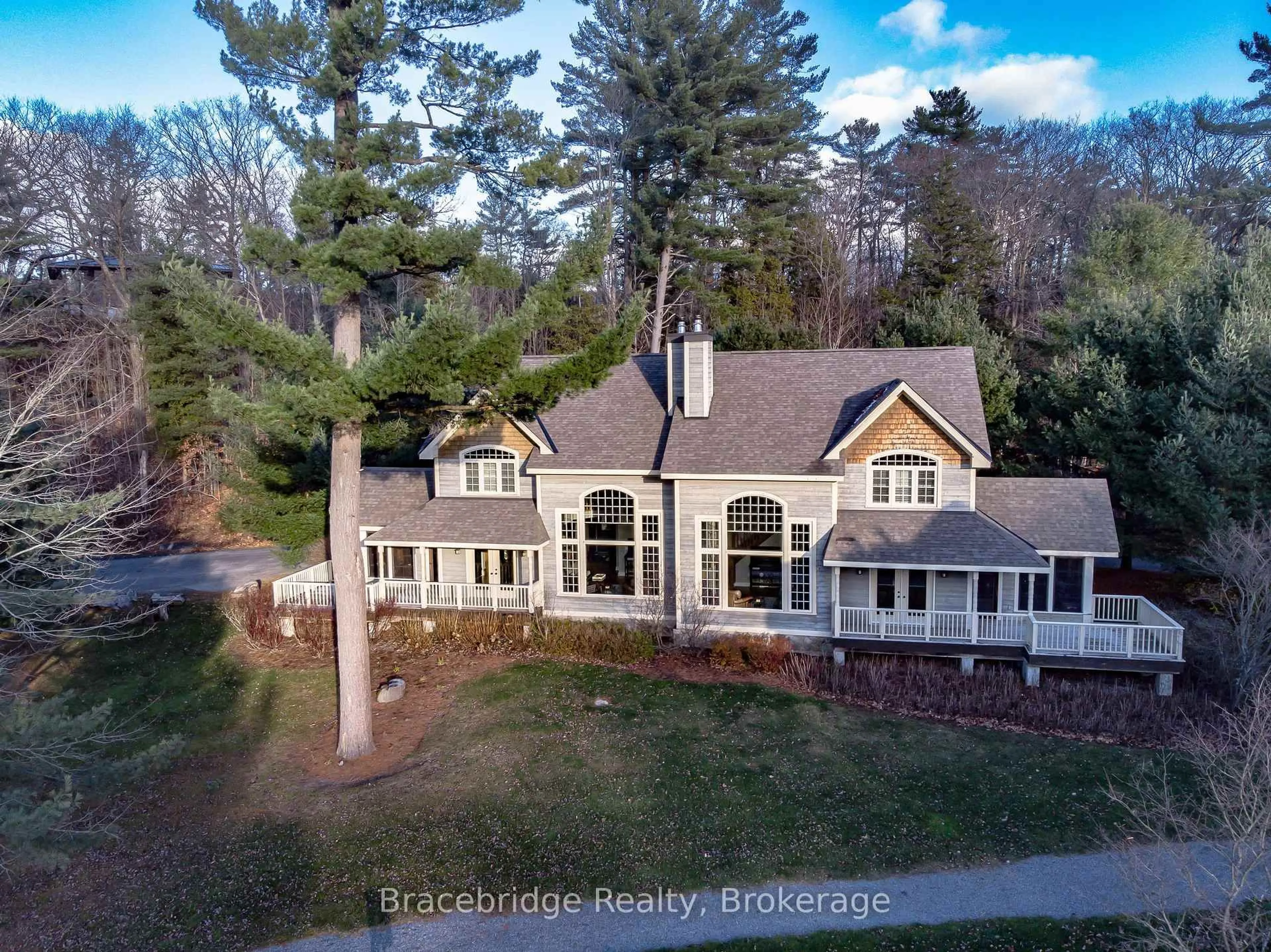 A pic from outside/outdoor area/front of a property/back of a property/a pic from drone, water/lake/river/ocean view for 3876 Muskoka Road 118 Rd, Muskoka Lakes Ontario P0B 1J0