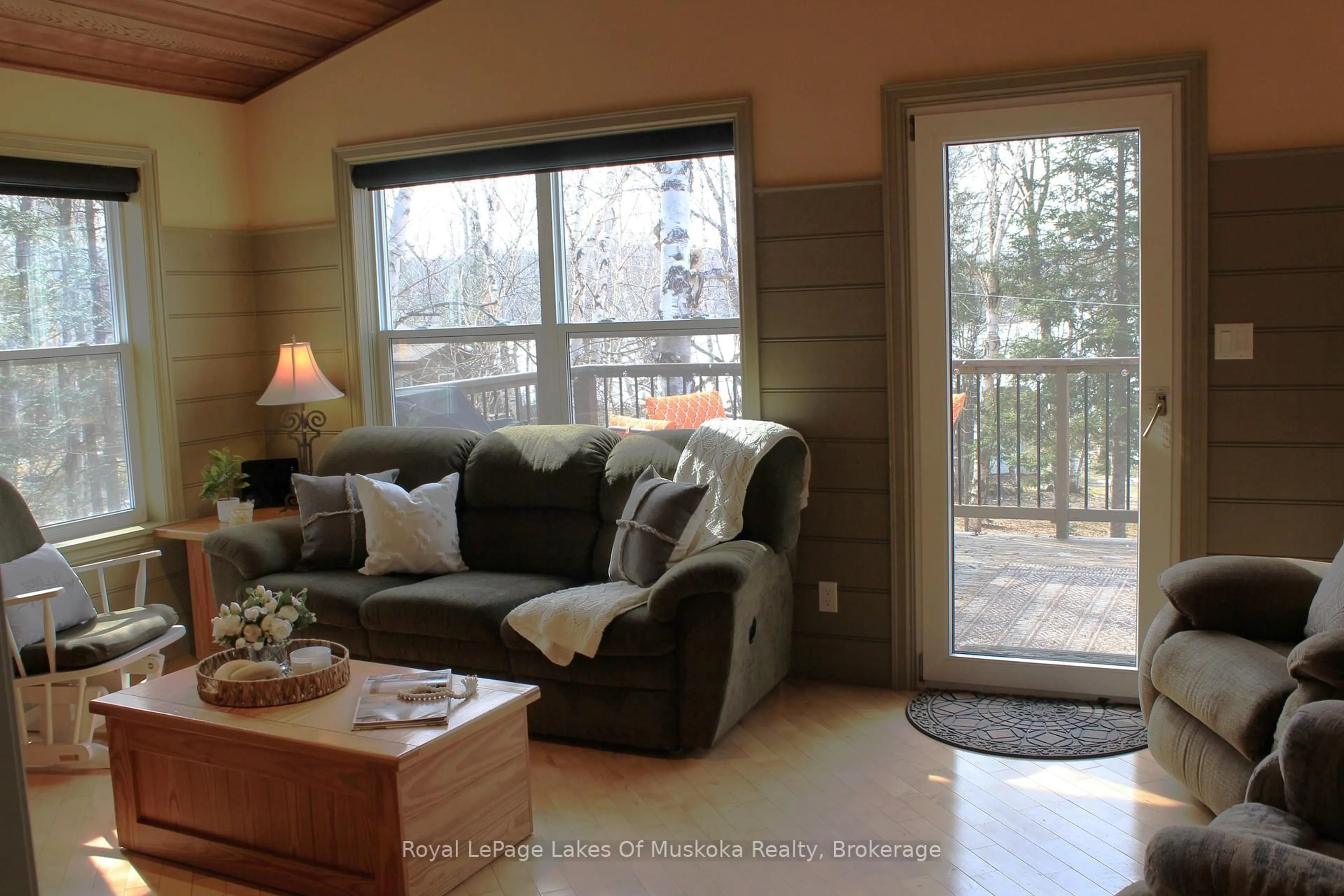 Living room with furniture, wood/laminate floor for 1136 LAKESIDE Tr, Magnetawan Ontario P0A 1P0