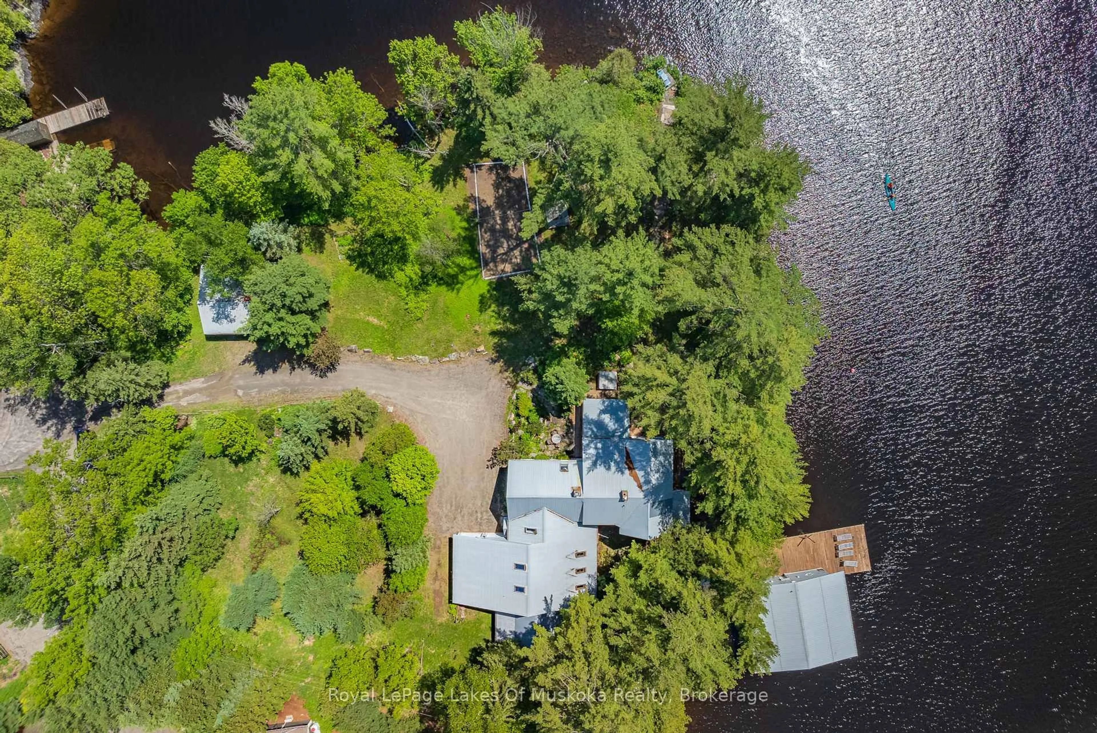 A pic from outside/outdoor area/front of a property/back of a property/a pic from drone, water/lake/river/ocean view for 928 JONES Lane, Huntsville Ontario P1H 1B2