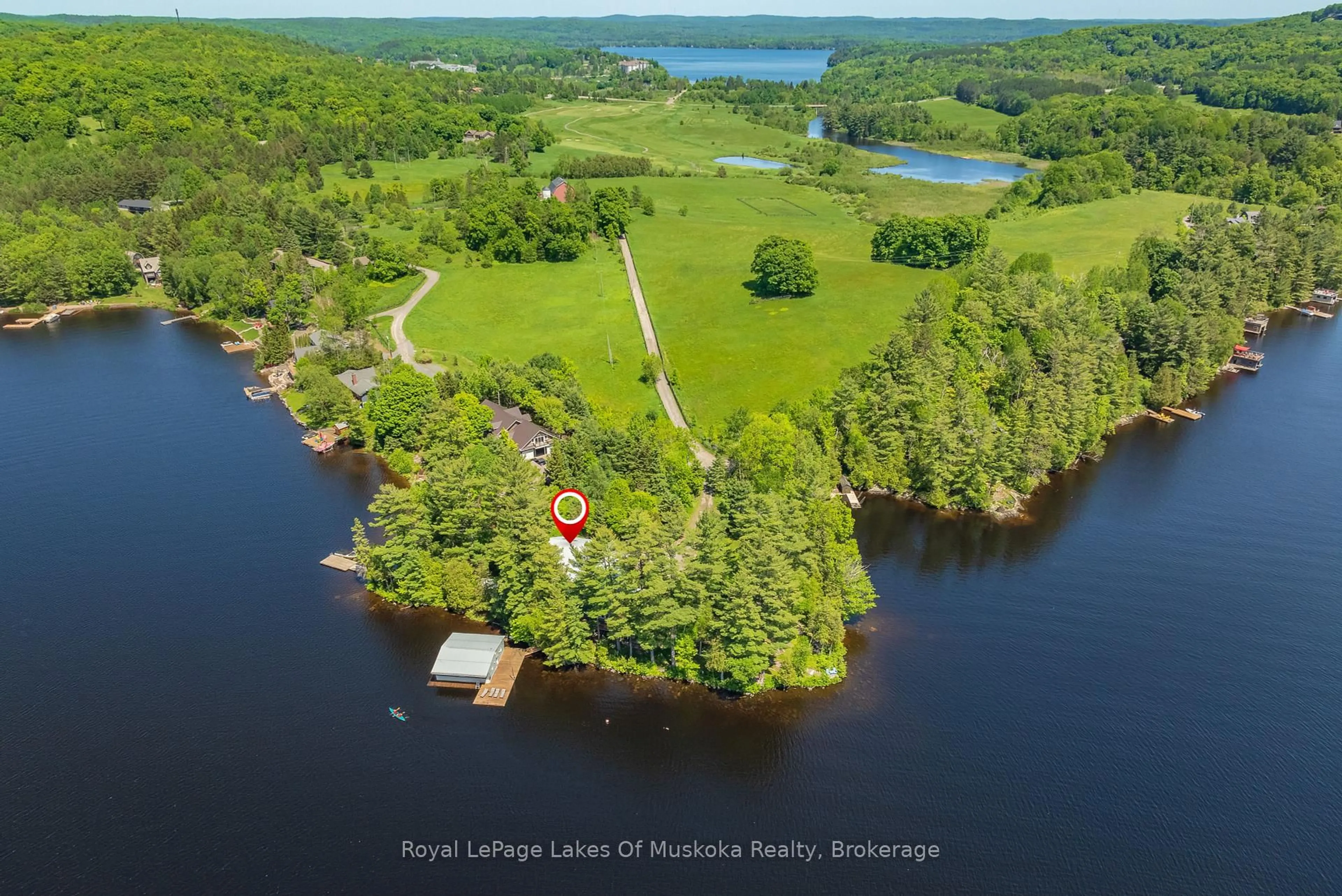 A pic from outside/outdoor area/front of a property/back of a property/a pic from drone, water/lake/river/ocean view for 928 JONES Lane, Huntsville Ontario P1H 1B2