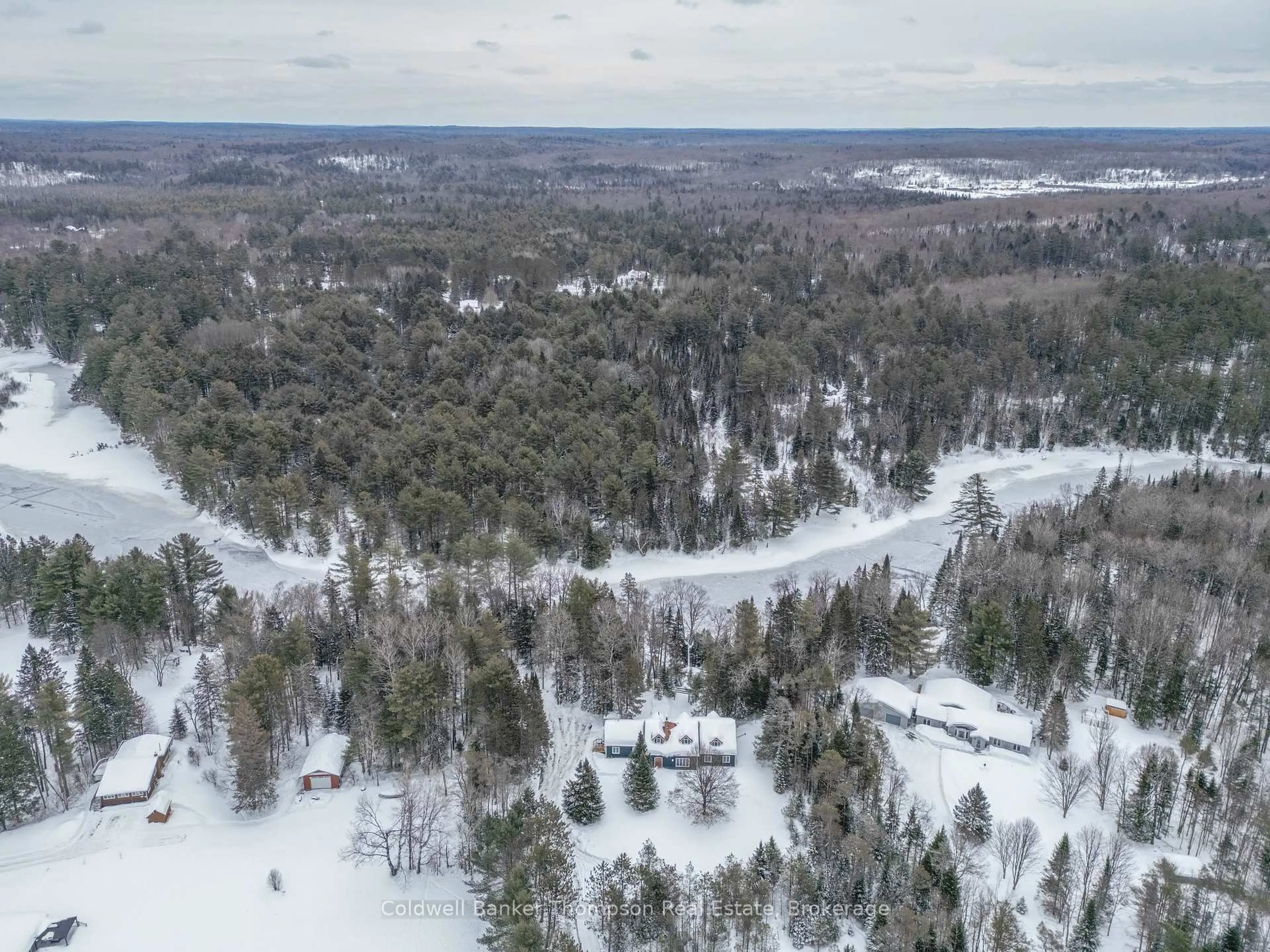 A pic from outside/outdoor area/front of a property/back of a property/a pic from drone, forest/trees view for 43 Hiawatha Dr, Huntsville Ontario P0B 1L0