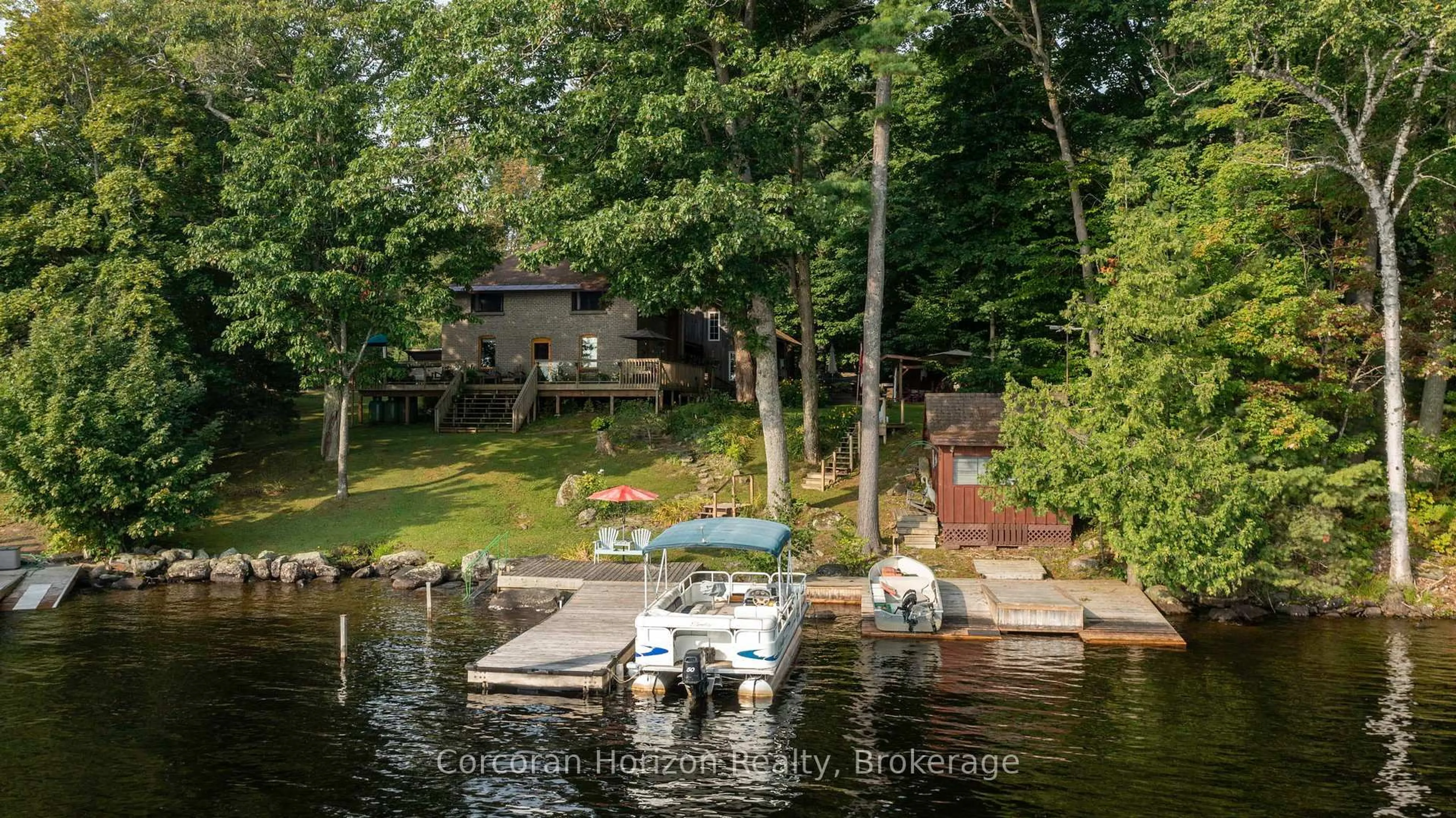 A pic from outside/outdoor area/front of a property/back of a property/a pic from drone, water/lake/river/ocean view for 1641 WALKERS POINT Rd, Muskoka Lakes Ontario P1P 1R2