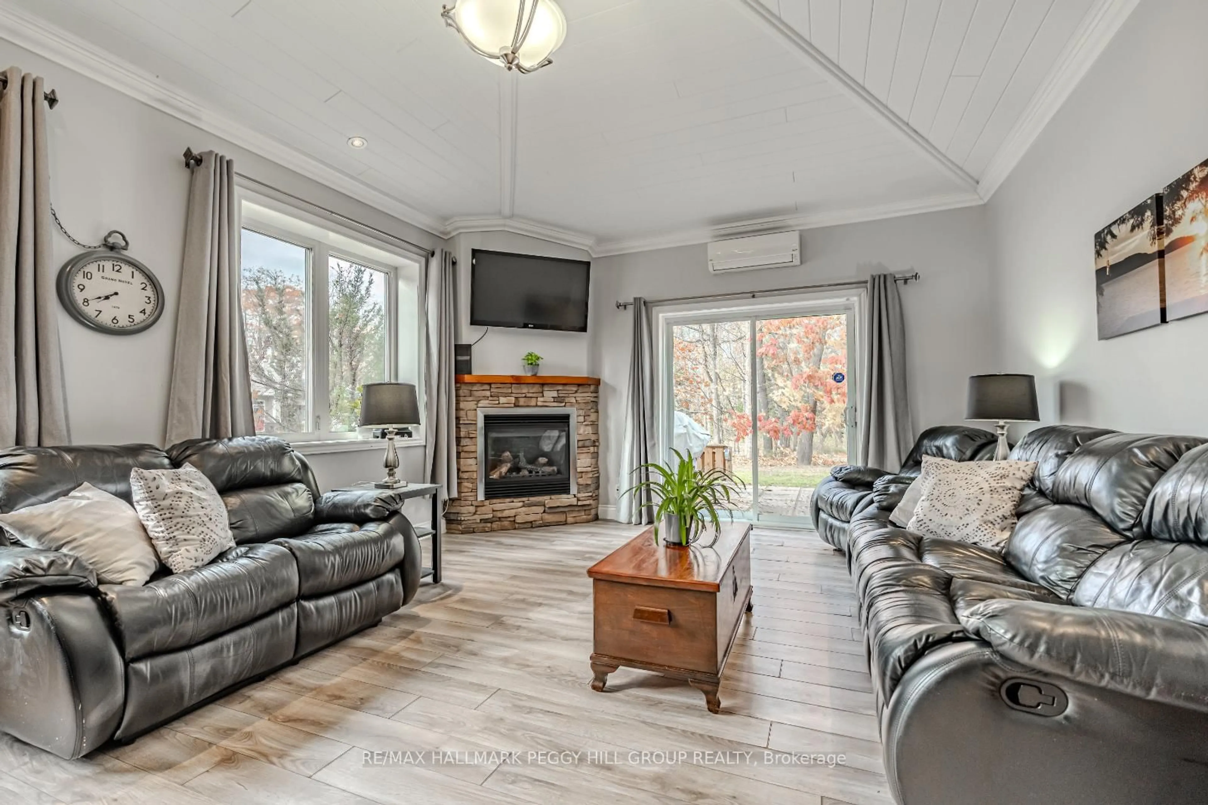 Living room with furniture, wood/laminate floor for 2 Jordan Lane, Huntsville Ontario P1H 1K9