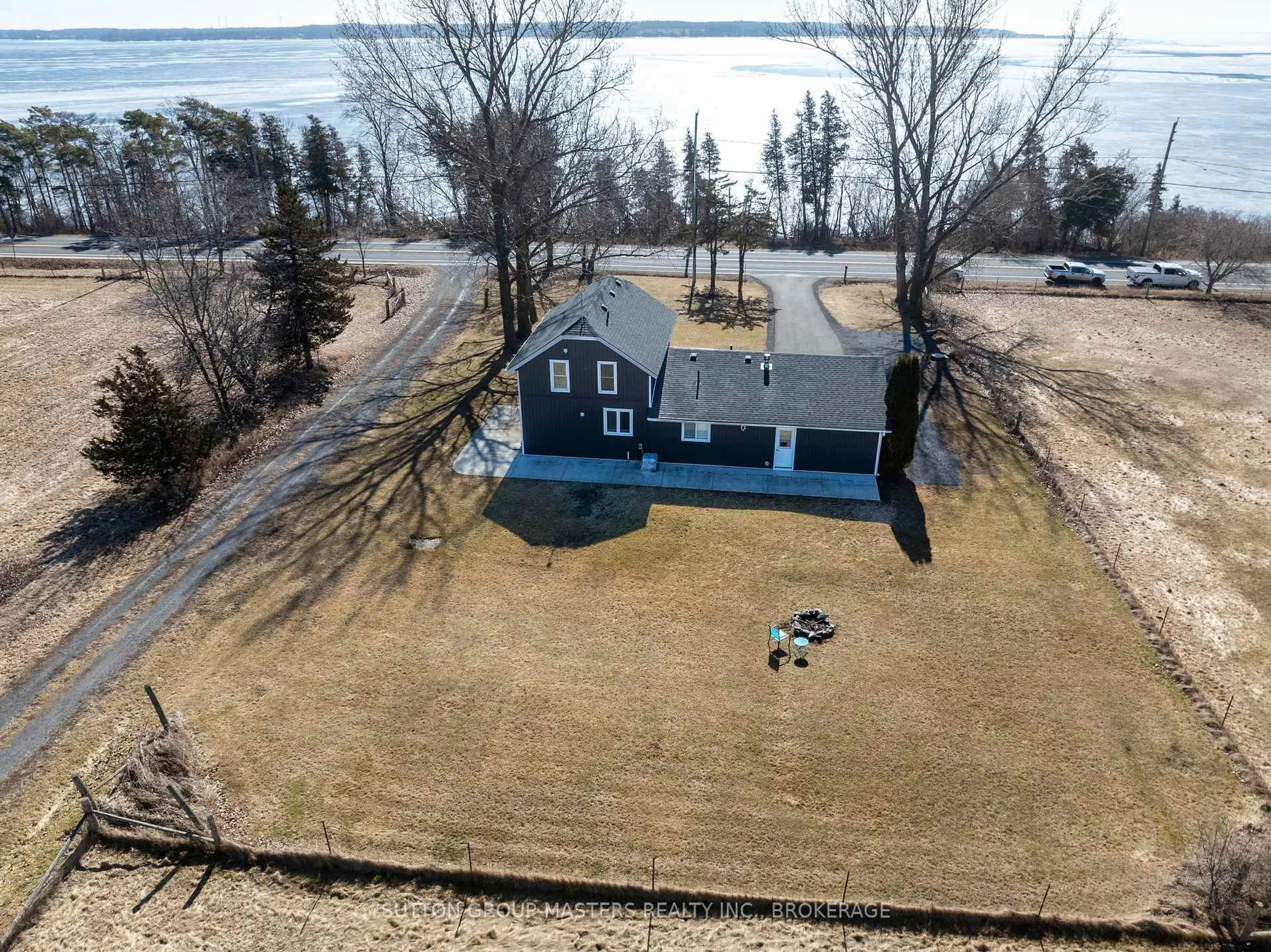 A pic from outside/outdoor area/front of a property/back of a property/a pic from drone, water/lake/river/ocean view for 6881 Loyalist Pkwy, Bath Ontario K0H 1G0