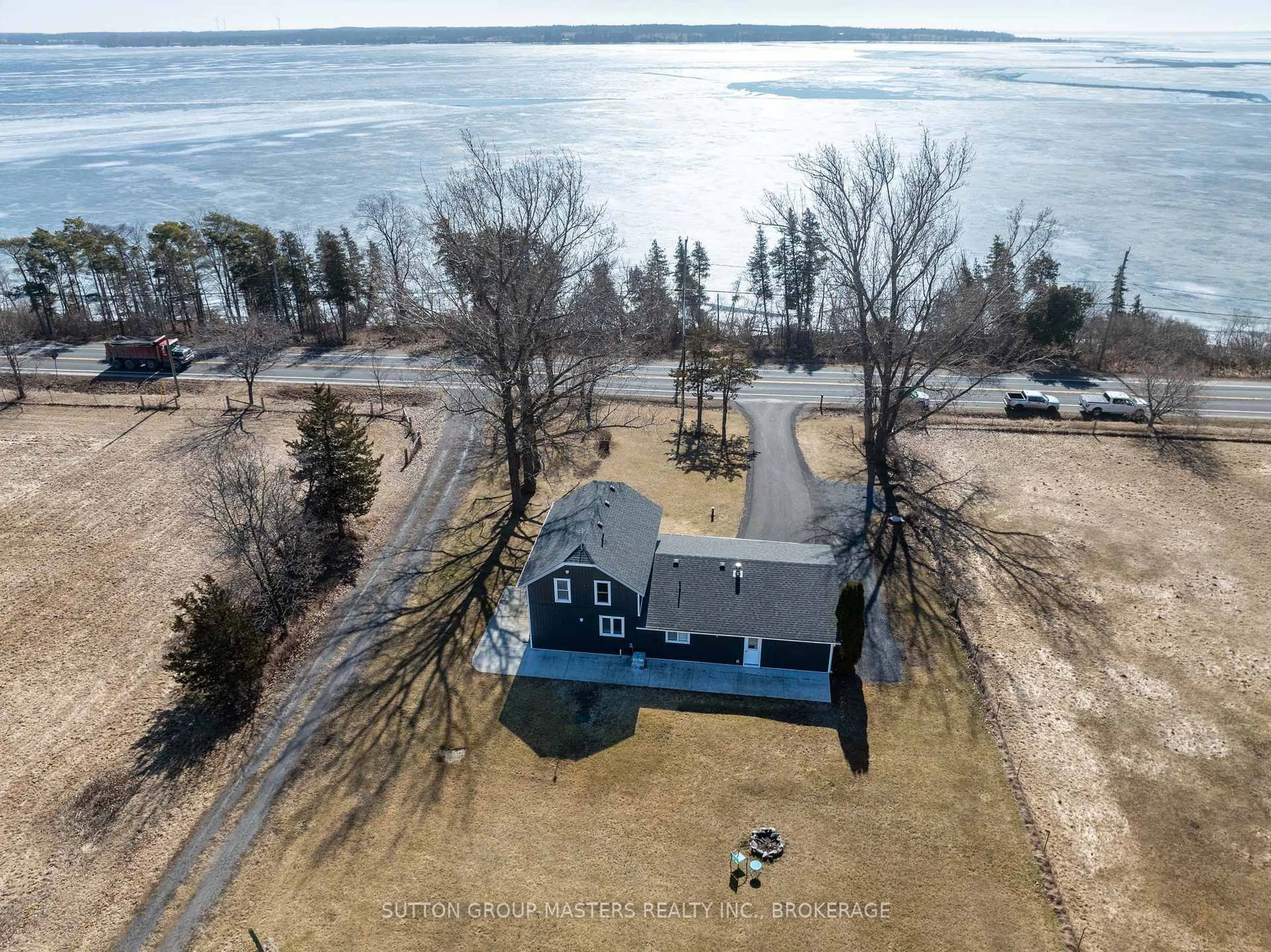 A pic from outside/outdoor area/front of a property/back of a property/a pic from drone, water/lake/river/ocean view for 6881 Loyalist Pkwy, Bath Ontario K0H 1G0