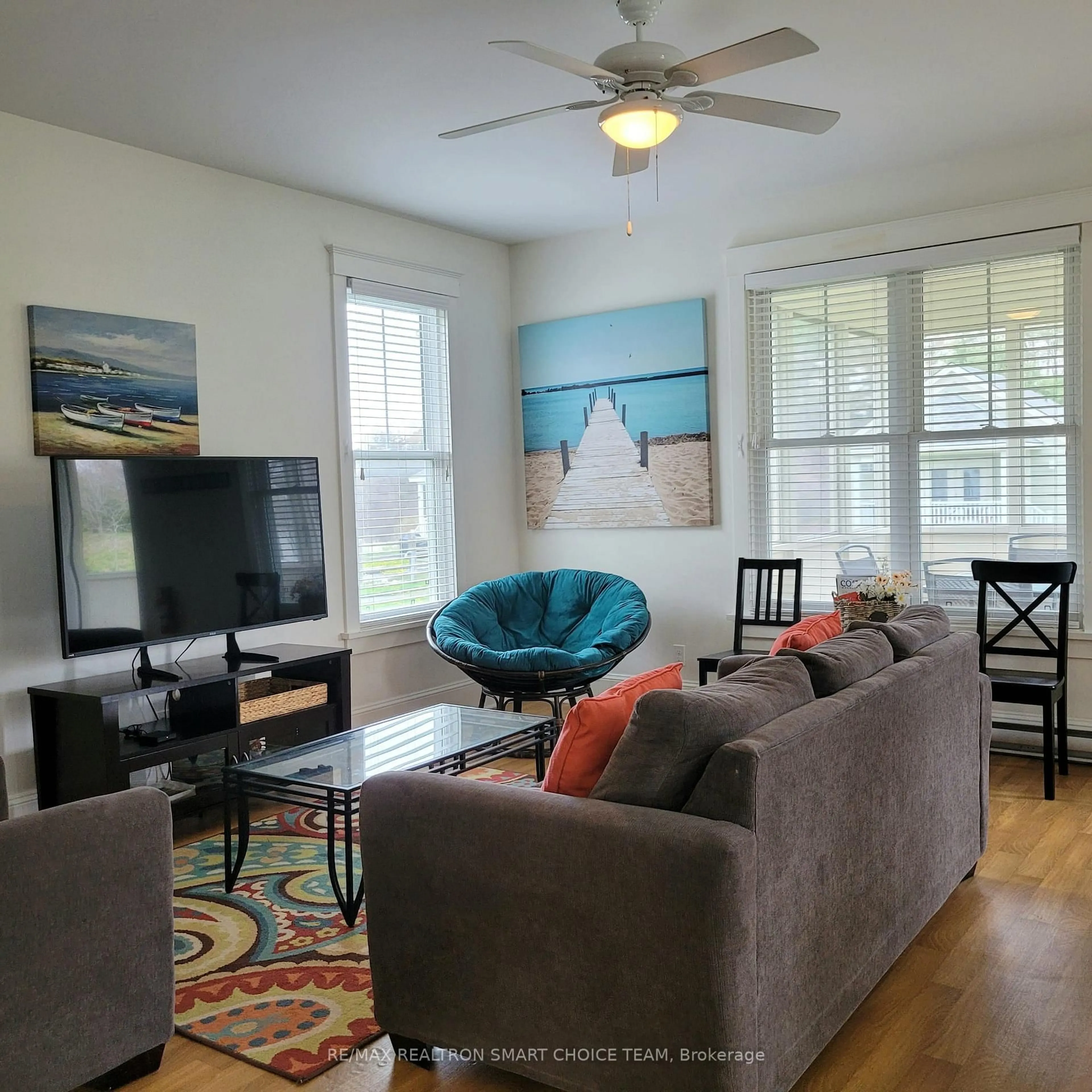 Living room with furniture, wood/laminate floor for 40 Meadow View Lane, Prince Edward County Ontario K0K 1P0
