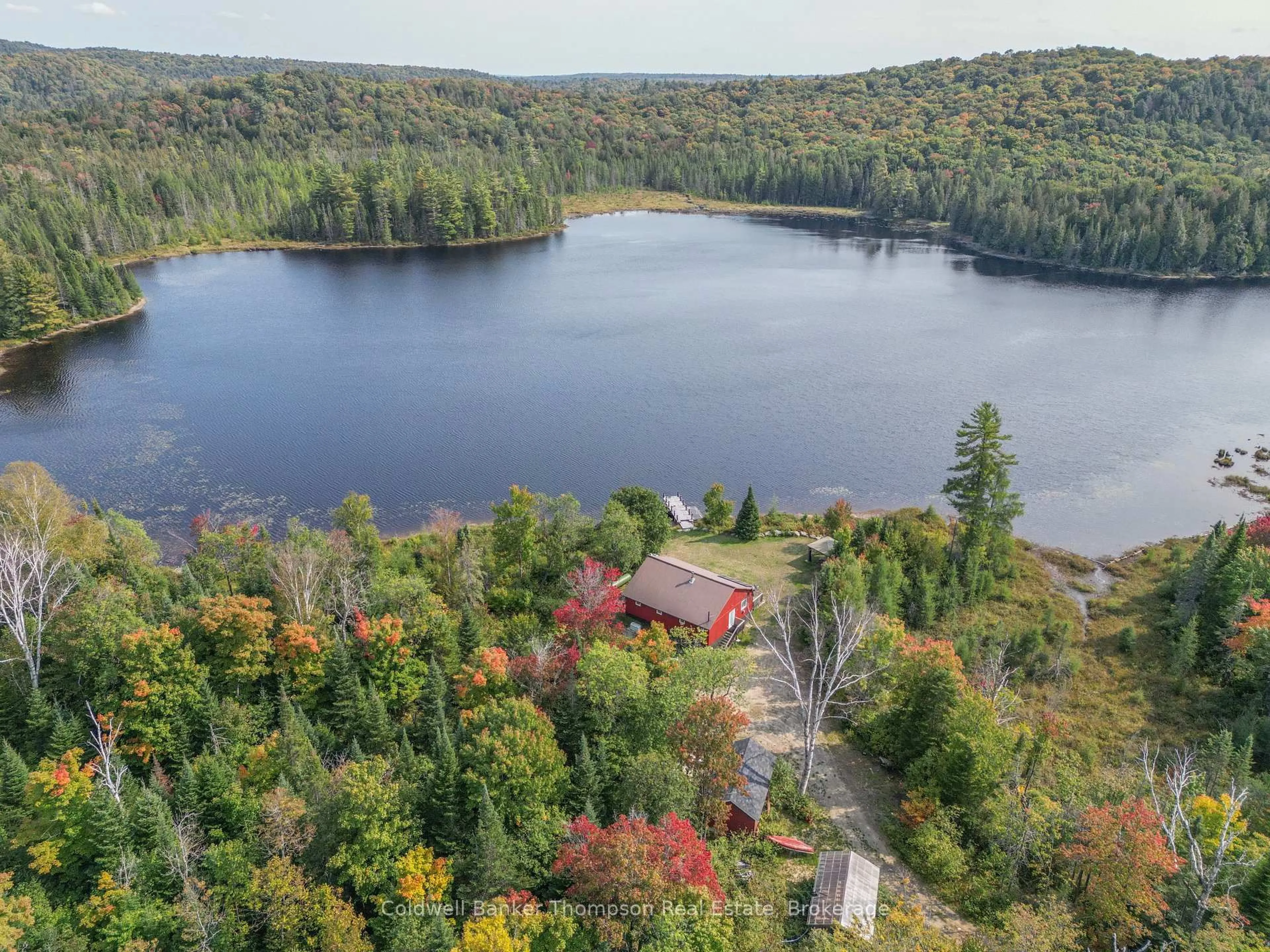 A pic from outside/outdoor area/front of a property/back of a property/a pic from drone, water/lake/river/ocean view for 1461 Rain Lake Rd, Kearney Ontario P0A 1M0