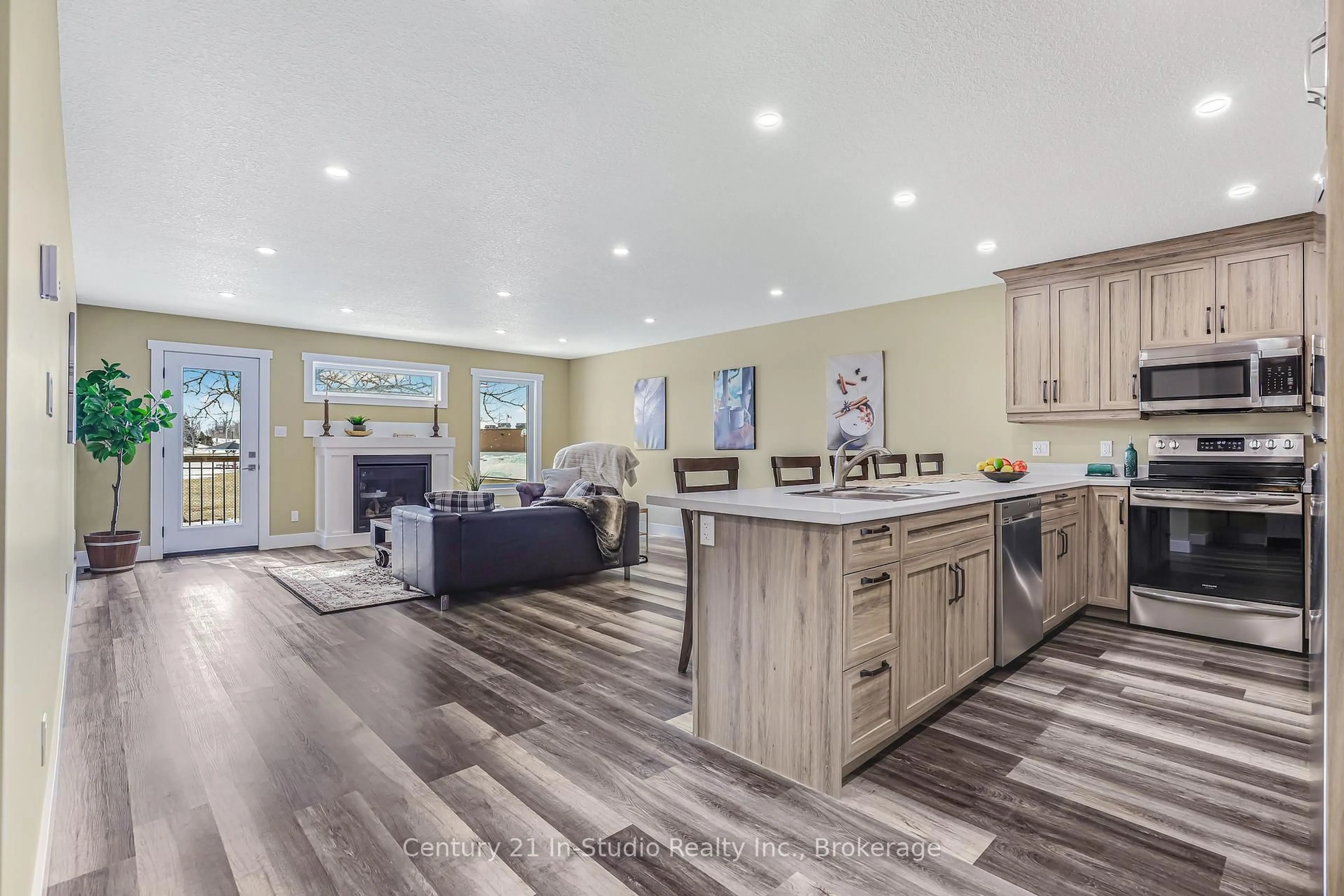 Open concept kitchen, wood/laminate floor for 201 Balaklava St, Arran-Elderslie Ontario N0G 2N0