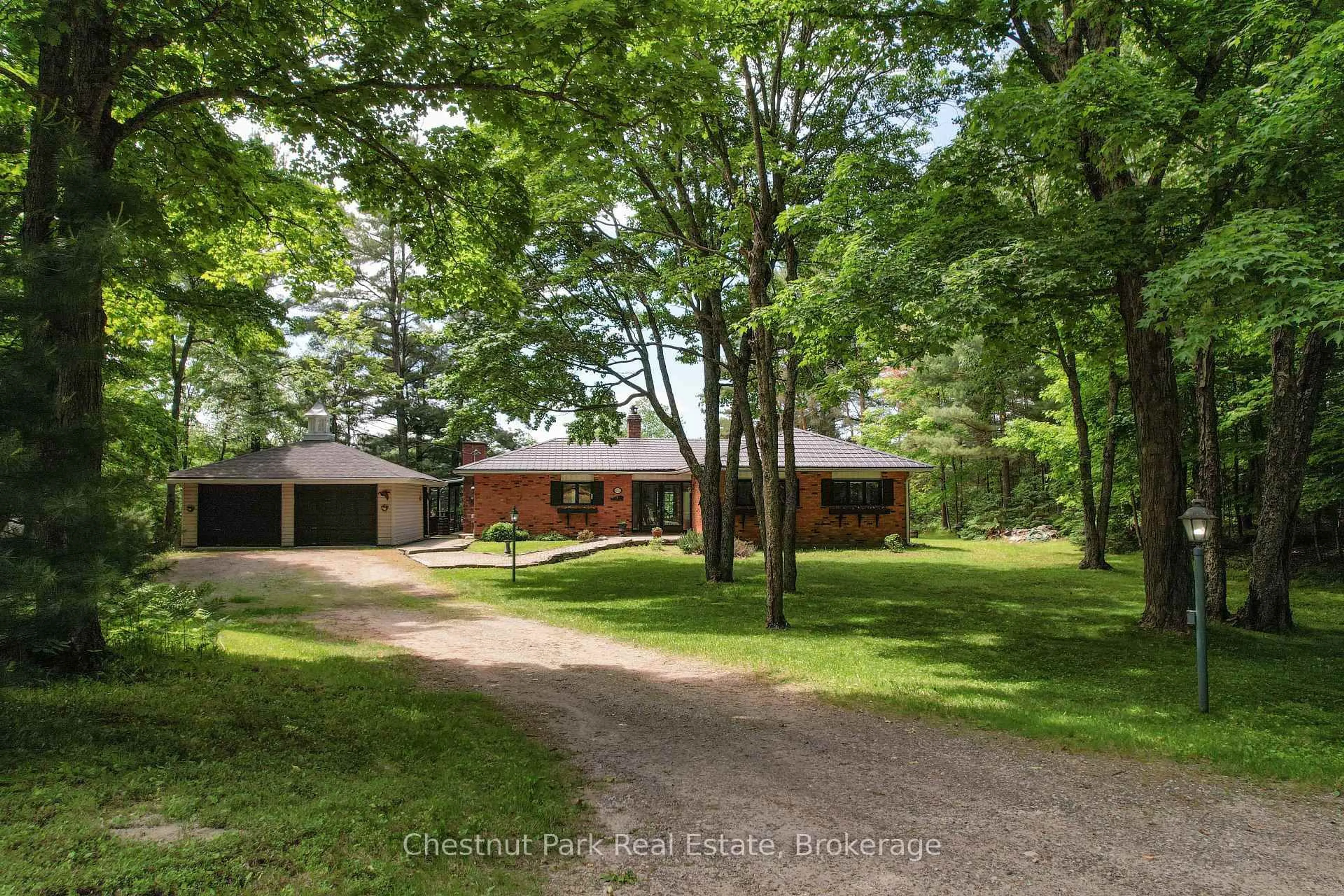 A pic from outside/outdoor area/front of a property/back of a property/a pic from drone, forest/trees view for 652 North Waseosa Lake Rd, Huntsville Ontario P1H 2J4