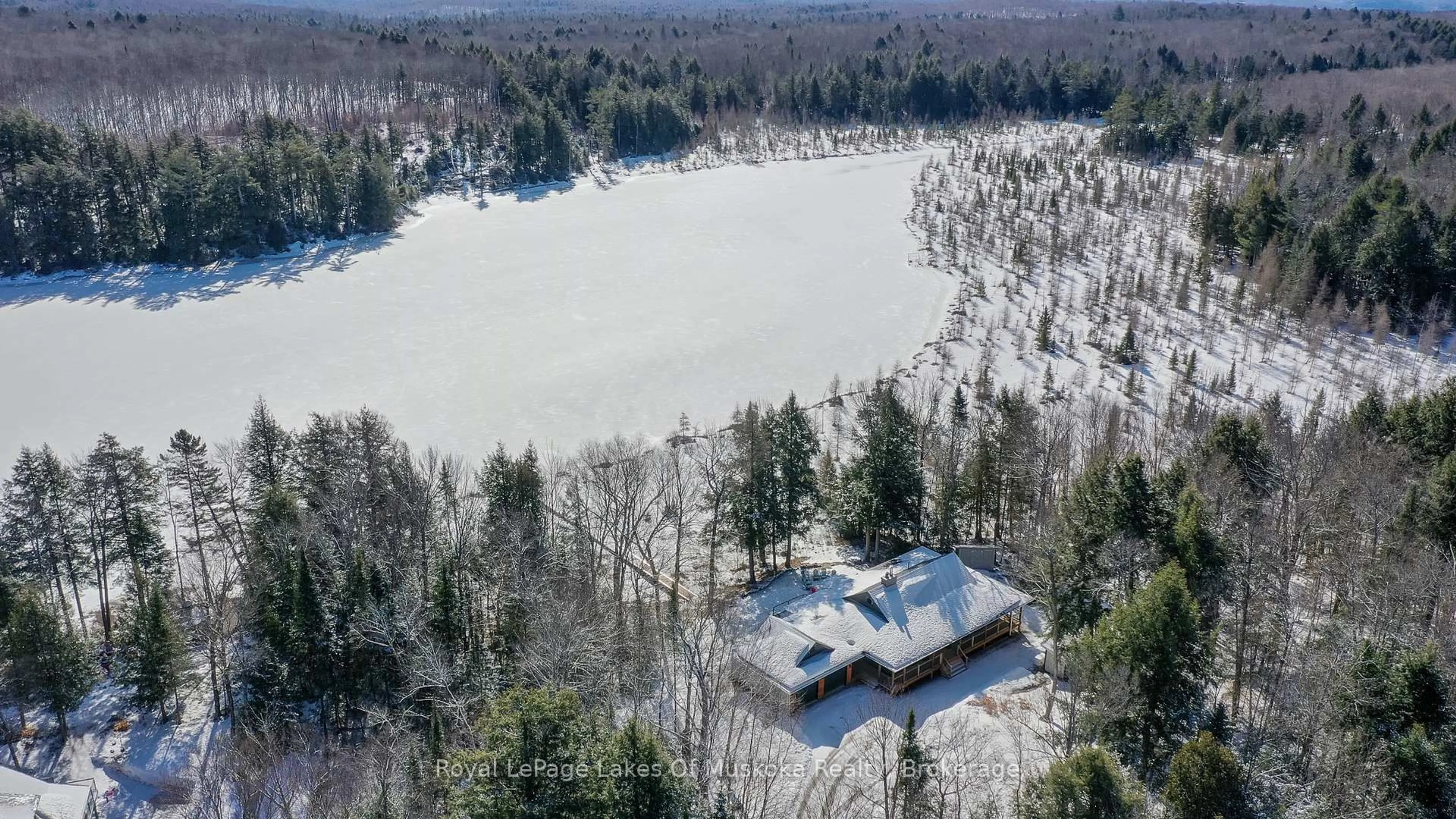 A pic from outside/outdoor area/front of a property/back of a property/a pic from drone, water/lake/river/ocean view for 1420 Limberlost Rd, Lake of Bays Ontario P1H 2J6