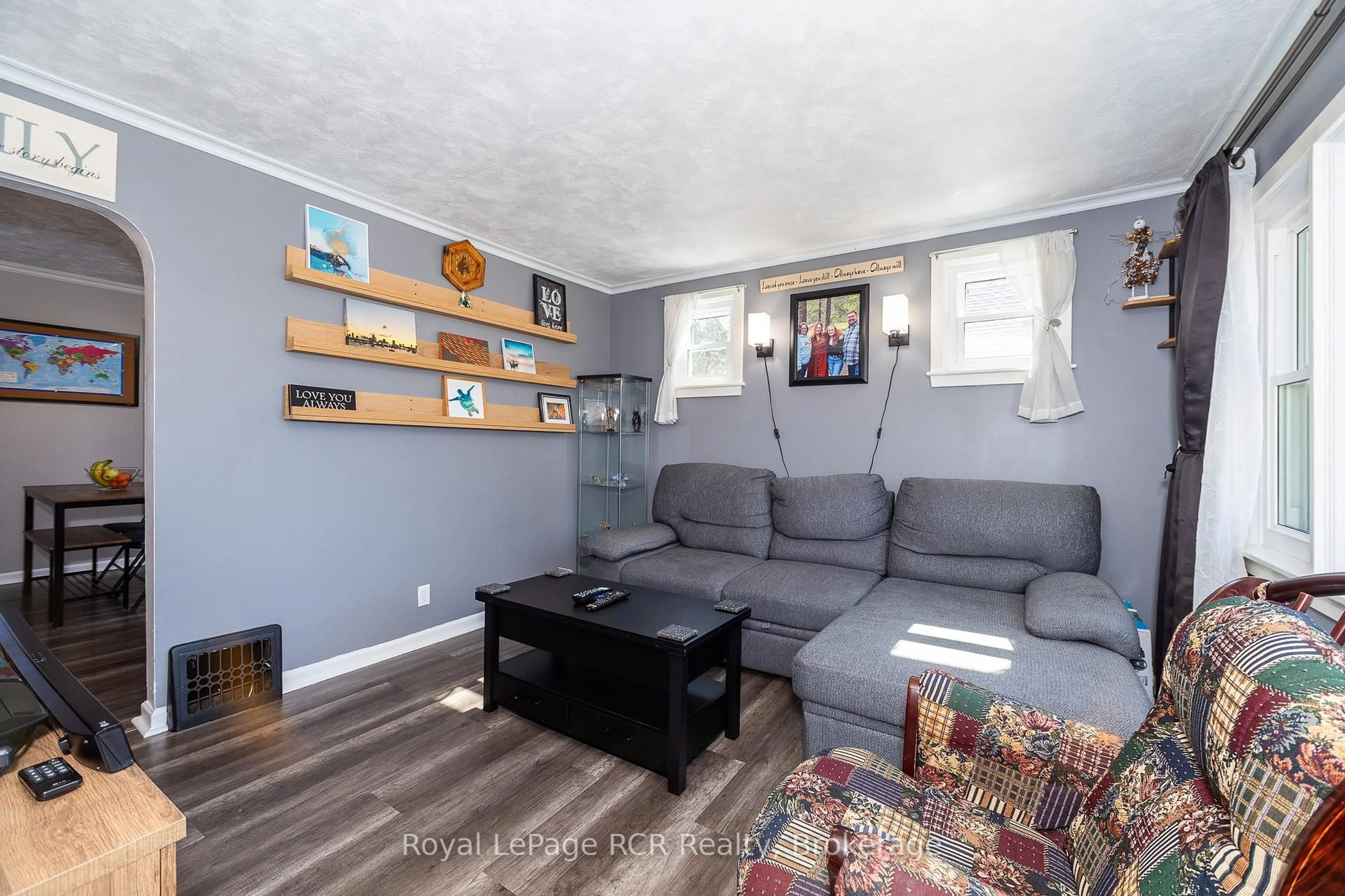 Living room with furniture, wood/laminate floor for 807 7th Ave, Owen Sound Ontario N4K 2Y4