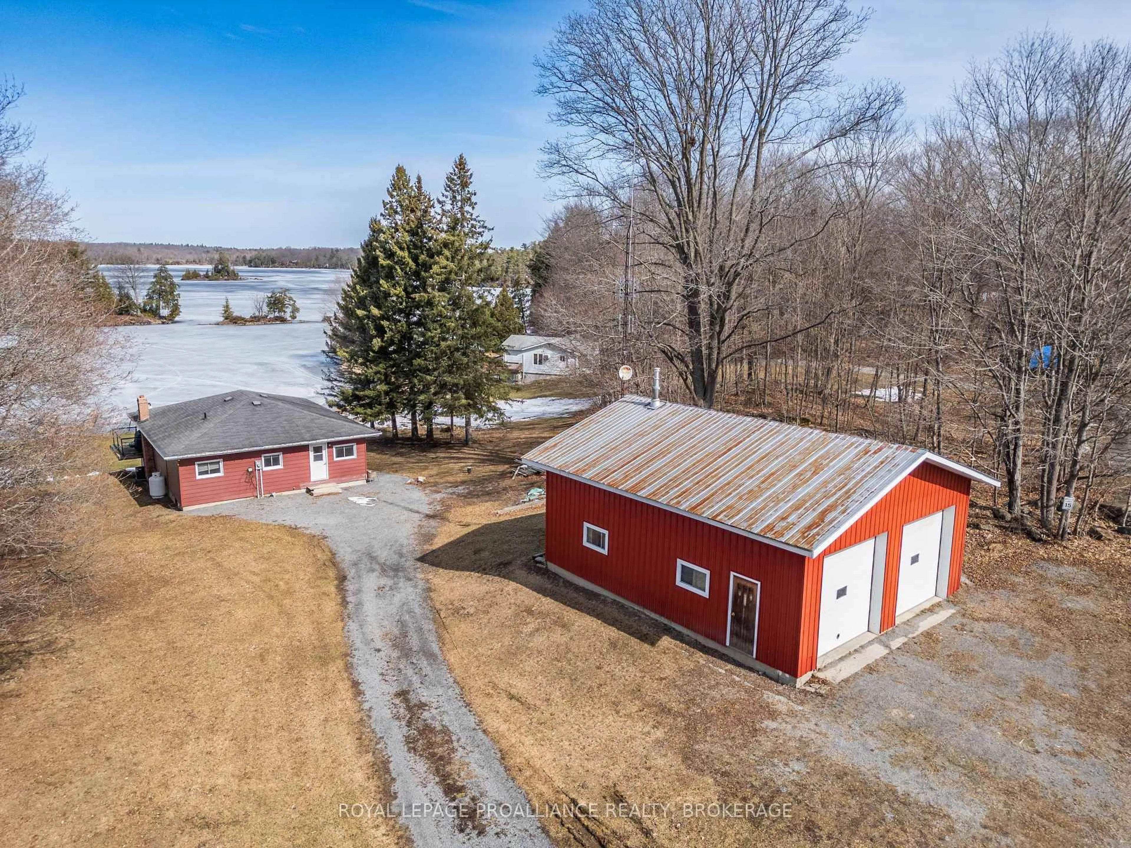 A pic from outside/outdoor area/front of a property/back of a property/a pic from drone, water/lake/river/ocean view for 4581 Wild Life Lane, Battersea Ontario K0H 1H0