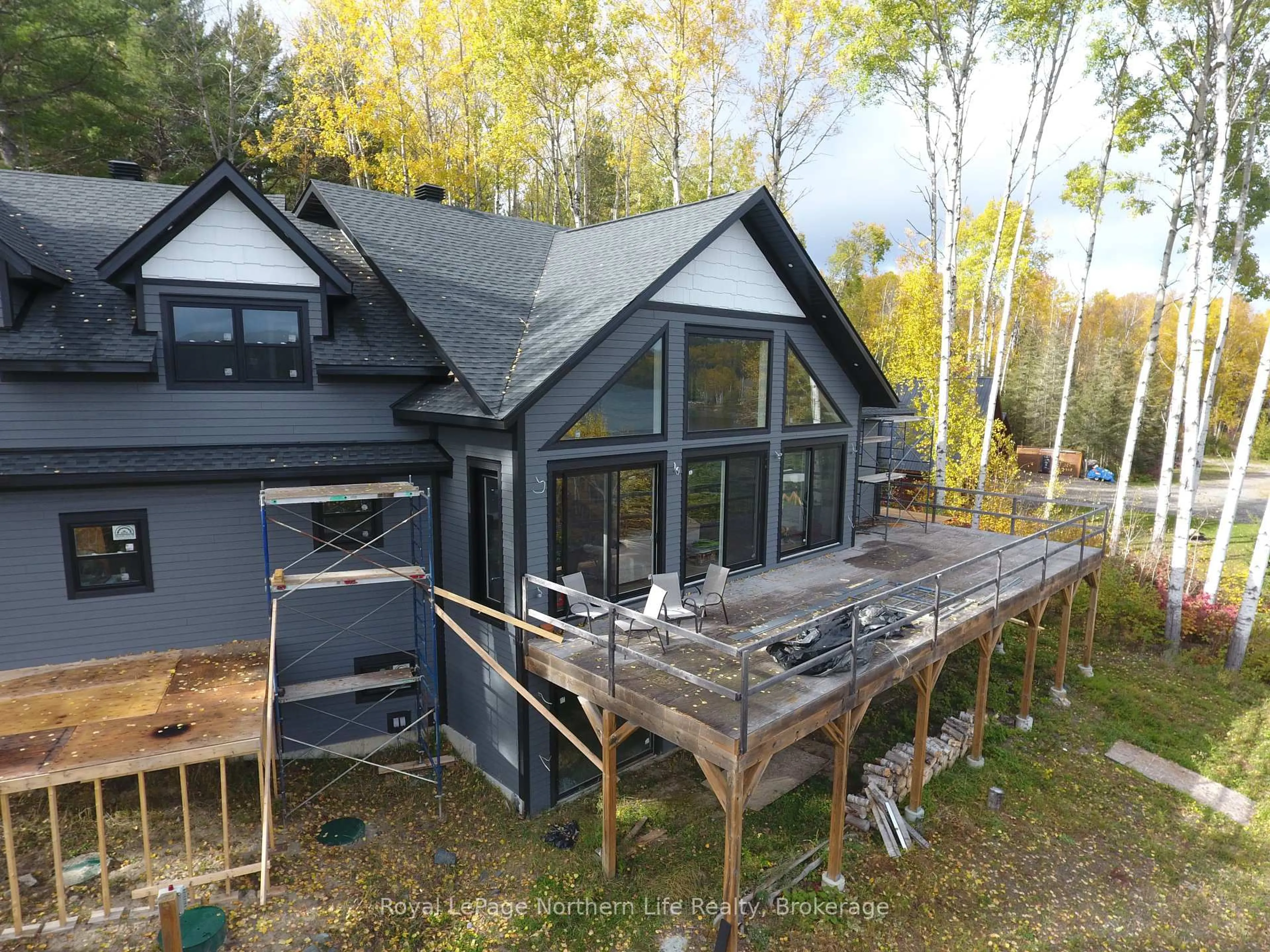 A pic from outside/outdoor area/front of a property/back of a property/a pic from drone, water/lake/river/ocean view for 429 FOX RUN Dr, Temagami Ontario P0H 2H0